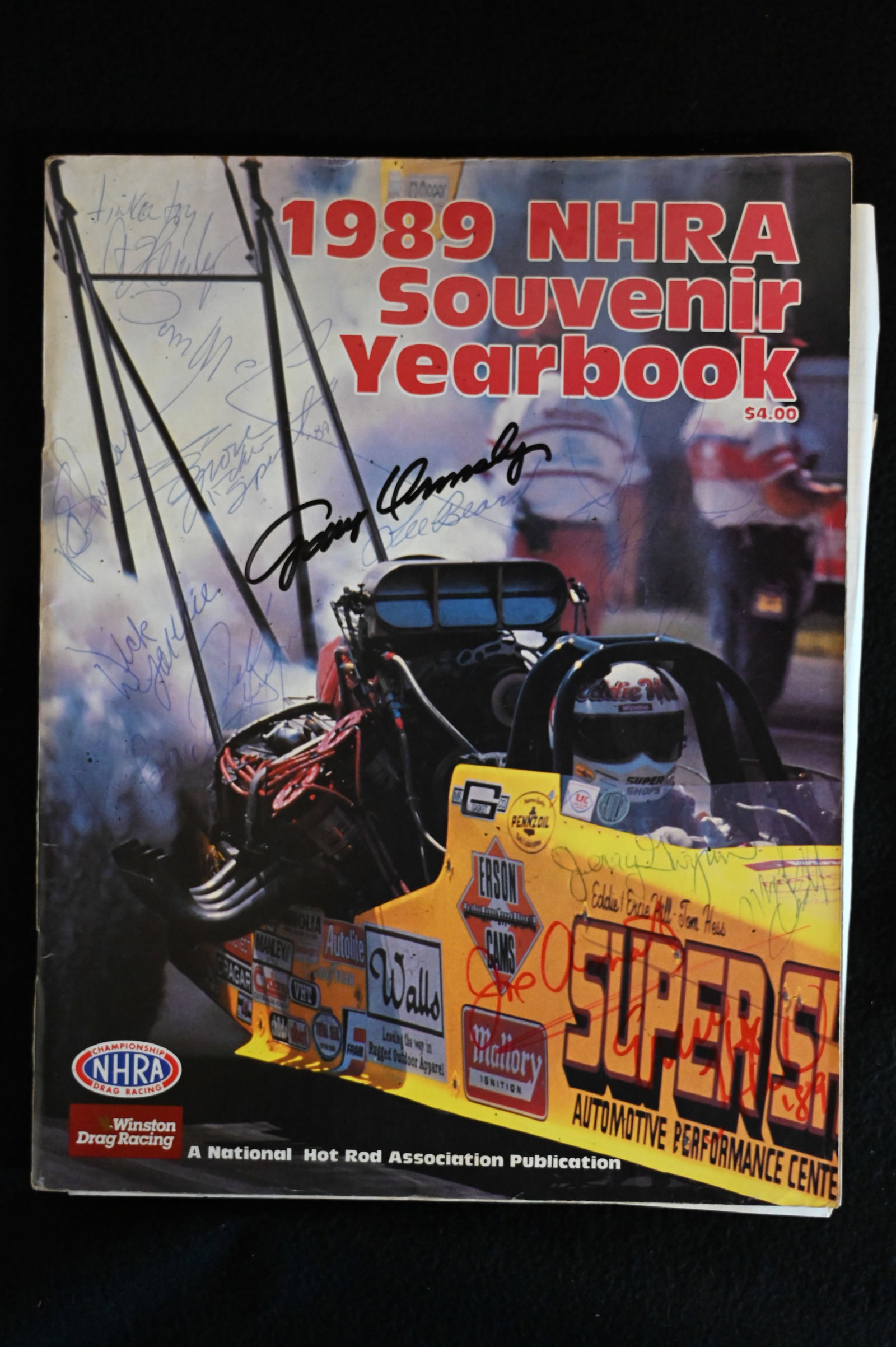 1989 U.S. Nationals Souvenir Yearbook NHRA with over 38 Autographs. Includes John Force, Tom: 1989 U.S. Nationals Souvenir Yearbook NHRA with over 38 Autographs. Includes John Force, Tom Mcewen, Warren Johnson & many more.