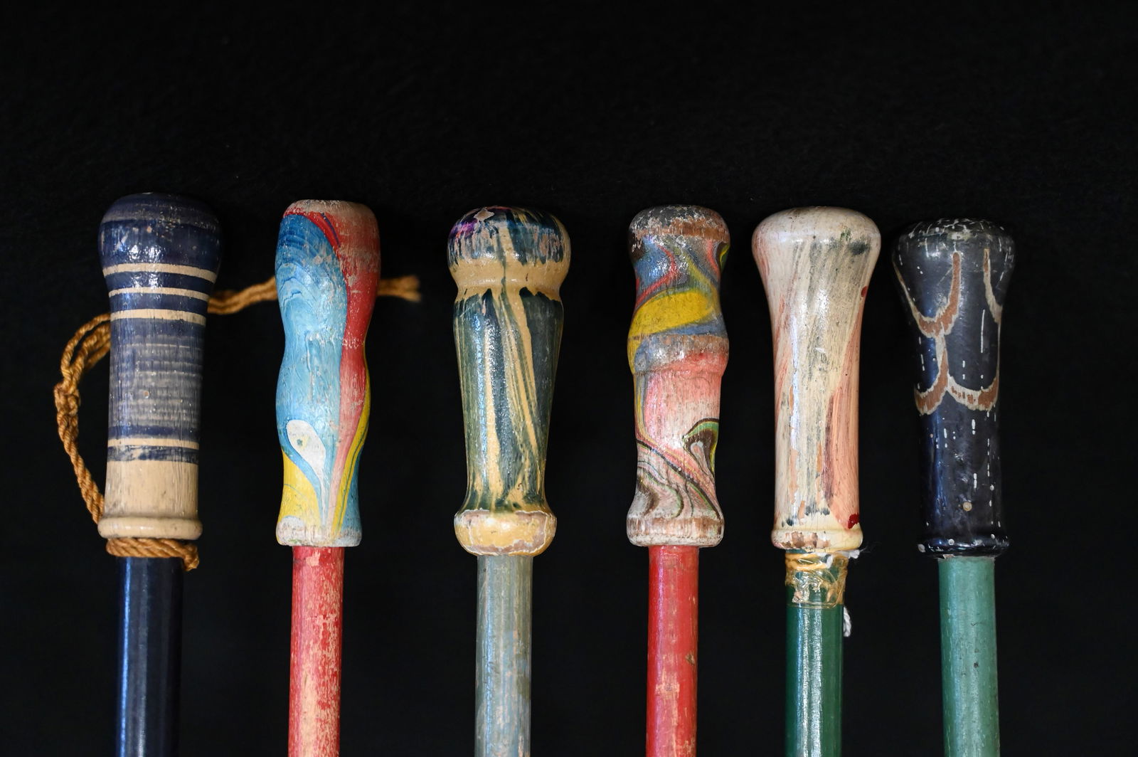 6 Carnival Canes with a Ceramic/Porcelain Colorful Top on top of a wood rod.  The canes are 34"-38" (1 of 4)