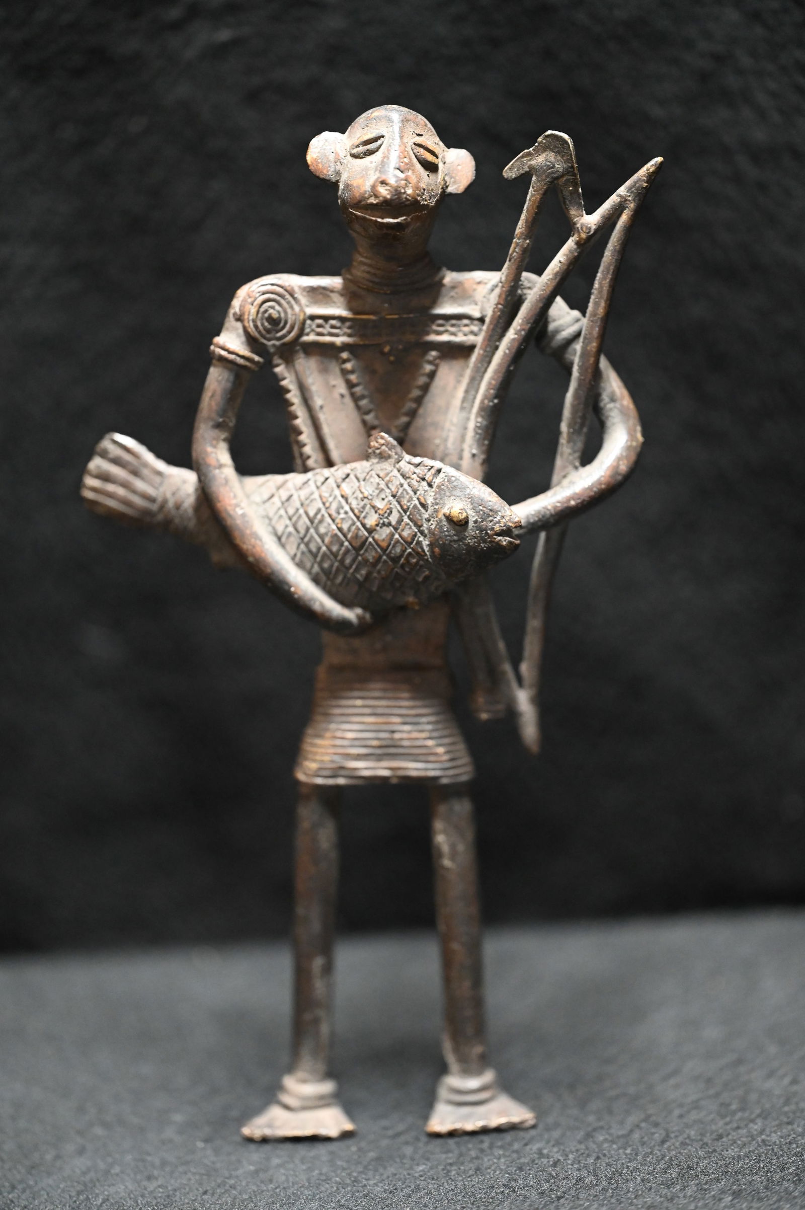Bronze Tribal Art Fisherman Statue.  Depicting a man with webbed feet holding a bow and arrow with a (1 of 5)