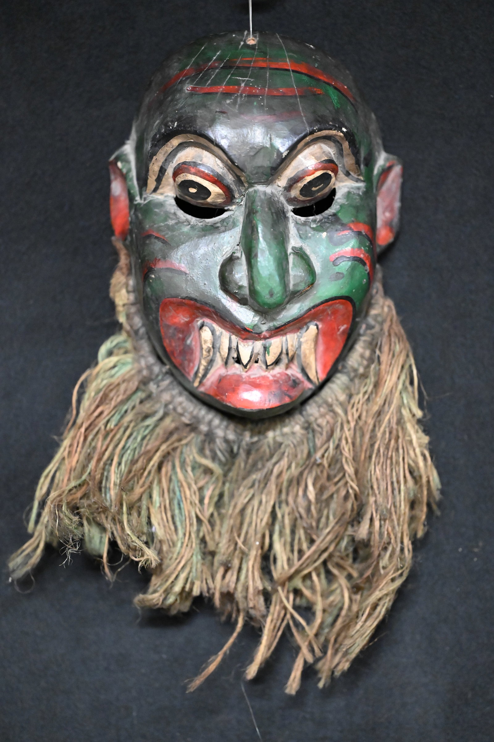 Sri Lanka Medicine Man Wood Dance Mask very colorful and detailed design with a rope beard.: Sri Lanka Medicine Man Wood Dance Mask very colorful and detailed design with a rope beard. Measures 8" x 6".