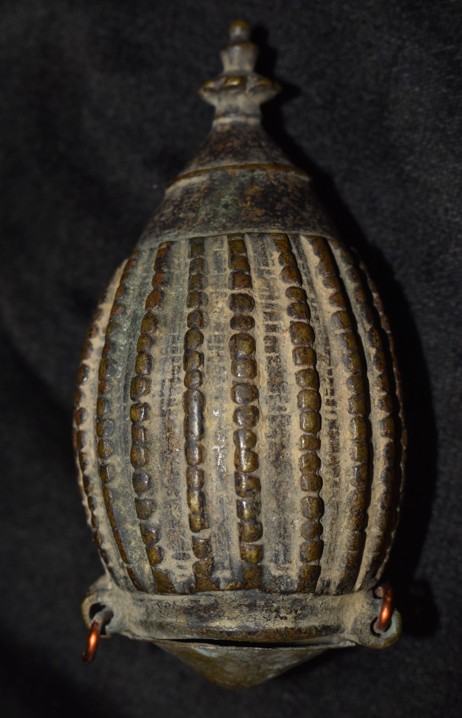 18th Century Bronze Betel Lime Purse or Oval Box from East India: 18th Century Bronze Betel Lime Purse or Oval Box from East India. Late 17th Century. Copper wires on the base likely replaced the old hinges that gave out over time. The metal cap on the bottom appear