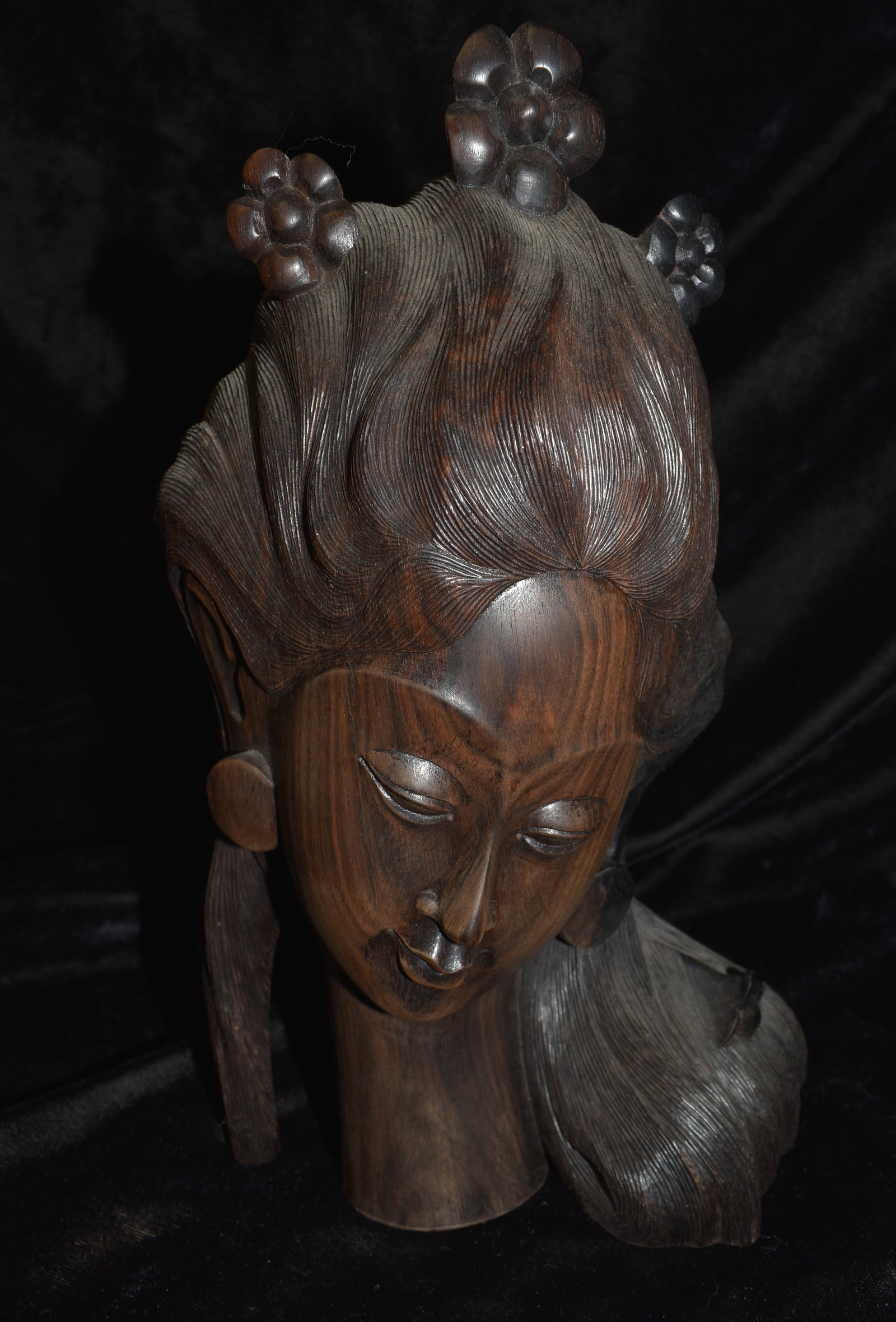 9 1/2" Teak Wood 1960s Finely Crafted Hard Wood Carving of an Indonesian Woman: 9 1/2" Teak Wood 1960s Finely Crafted Hard Wood Carving of an Indonesian Woman with Flowers in her Hair. Exceptional workmanship in a flawless sculpture from one solid piece of Teak Wood. Signed on th