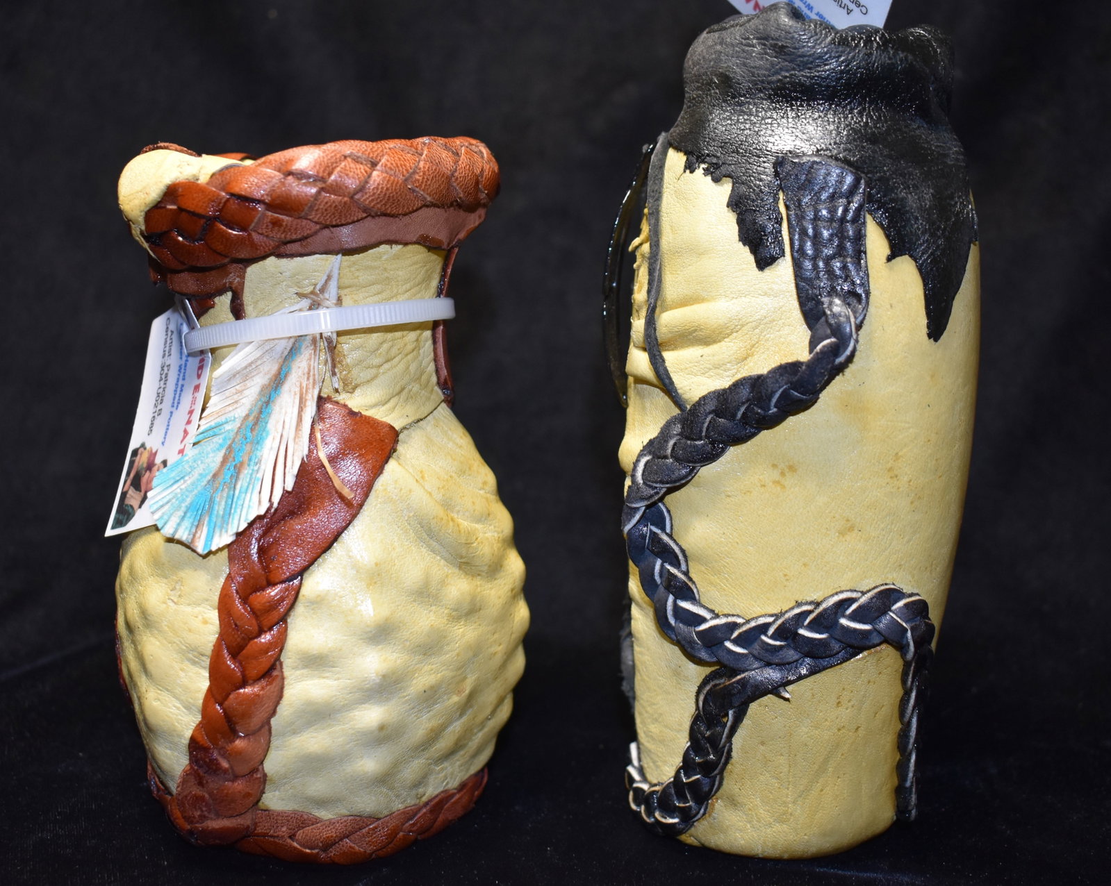 2 Chippewa Hand Made Leather Wrapped Pottery Jars by Artist Patricia Belgarde: 2 Chippewa Hand Made Leather Wrapped Pottery Jars by Artist Patricia Belgarde. 5 3/4" and 6 3/4" Tall