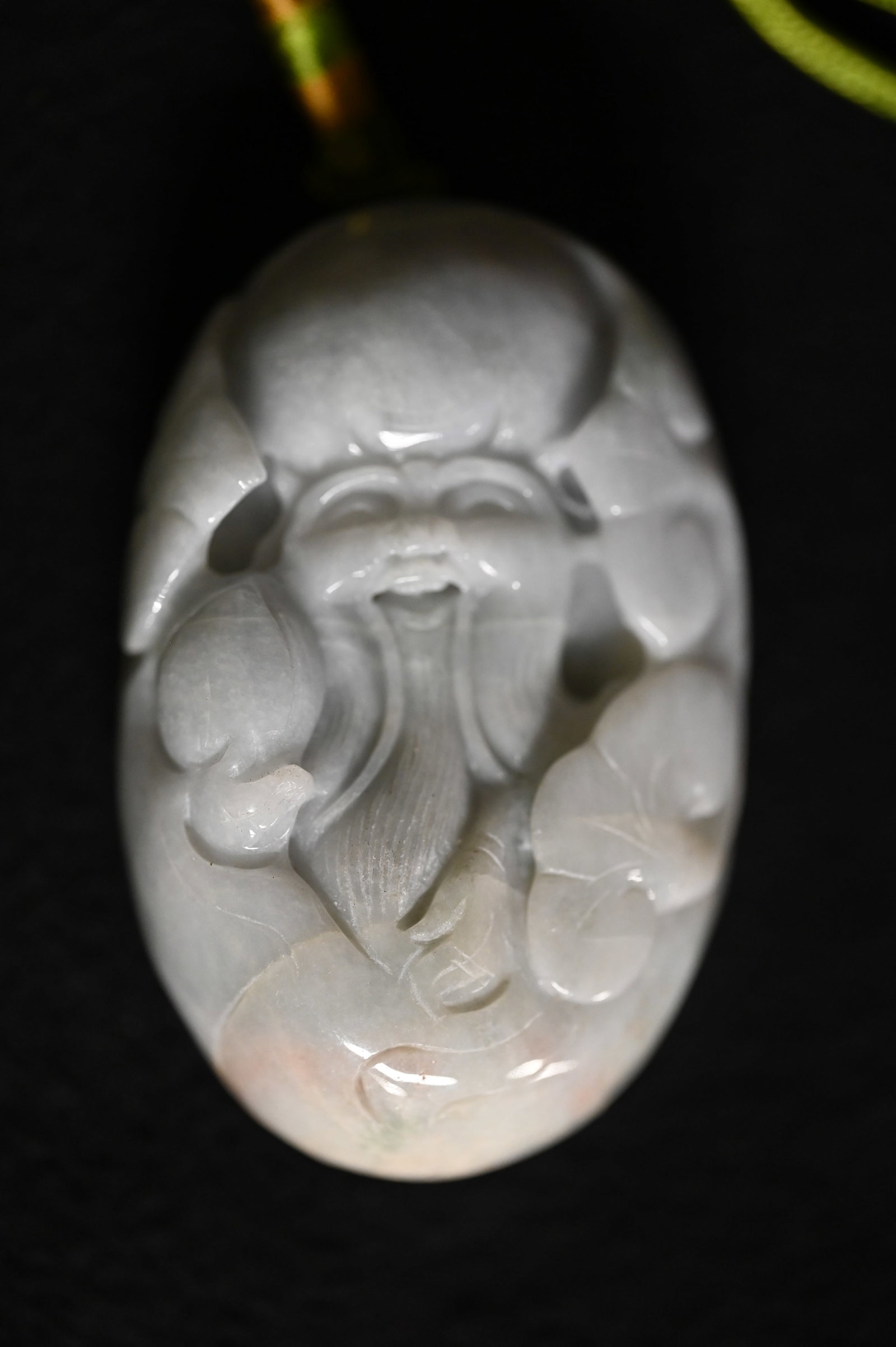Jade Pendant Budha Figure. Designed to hang from a wood stand. Measures 3" X 2" x 1".: Jade Pendant Budha Figure. Designed to hang from a wood stand. Measures 3" X 2" x 1".