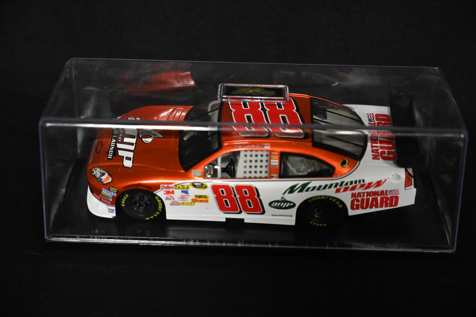 Dale Earnhardt Jr. "National Guard/Amp Energy" 1/24 Scale Diecast NASCAR Racecar in Hard Plastic: Dale Earnhardt Jr. "National Guard/Amp Energy" 1/24 Scale Diecast NASCAR Racecar in Hard Plastic Case.