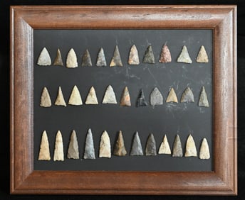 34 Triangle Bird Point Arrowheads Found in the Midwest Longest is 1 5/8".  The Frame is 10 1/4" x 12