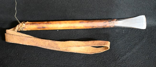 Plains Gun Barrel Hide Scrapper.  A hammered down gun barrel wrapped in hide with a leather strap