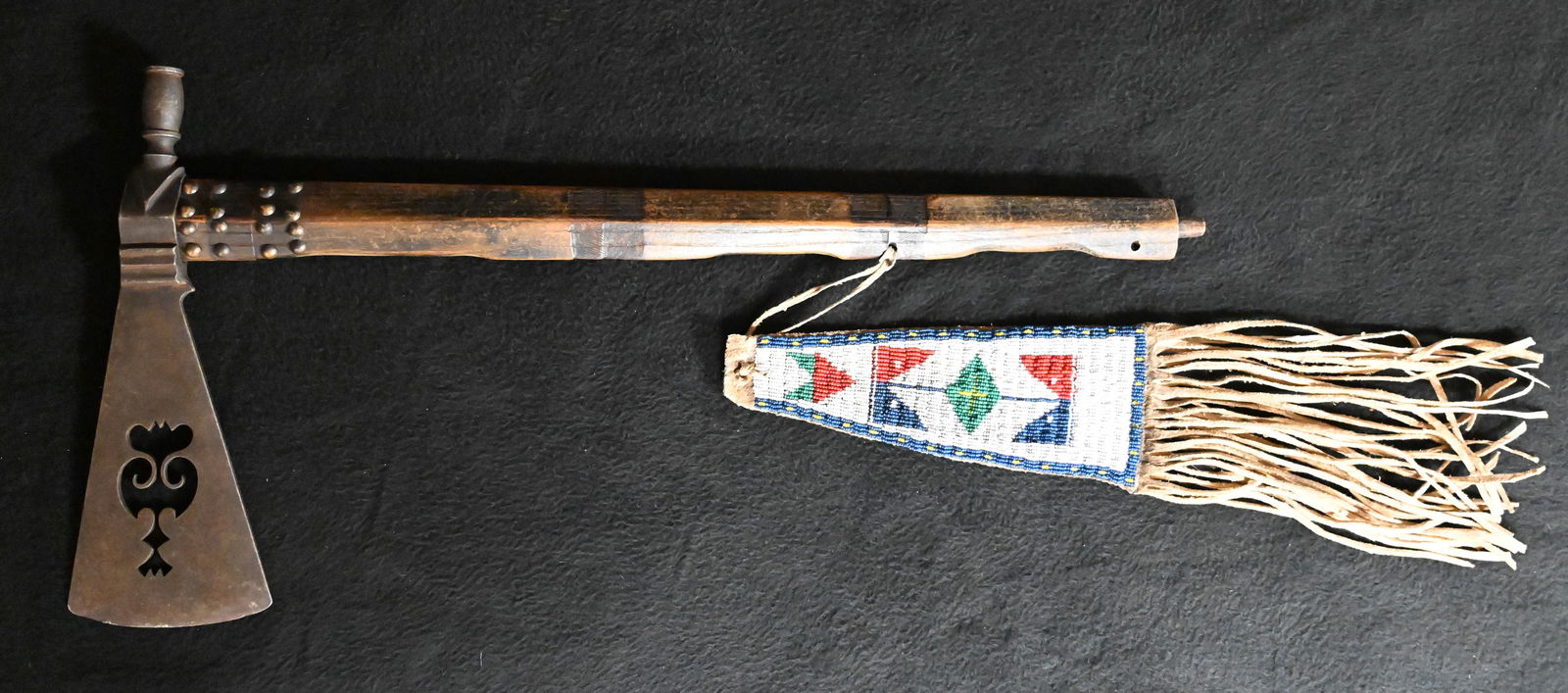 Pipe Tomahawk with Beaded Drop.  Iron axe head with wood handle. Brass tacked with a beaded drop. (1 of 9)