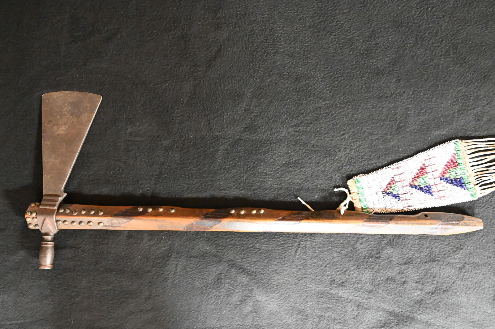 Pipe Tomahawk with Beaded Drop.  Iron axe head with wood handle. Brass tacked with a beaded drop. (1 of 10)