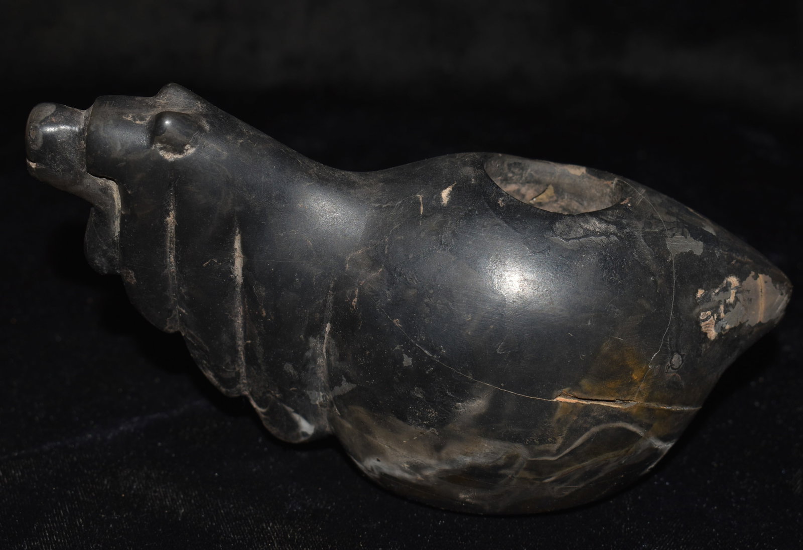 Highly Developed 6 1/4" Pre-Columbian Incan Canopa found in Central America: Highly Developed 6 1/4" Pre-Columbian Incan Canopa. This canopa shows signs of heavy use. It has a rounded out inner bowl with long neck mane intricately carved to the neck of the Llama it represents.