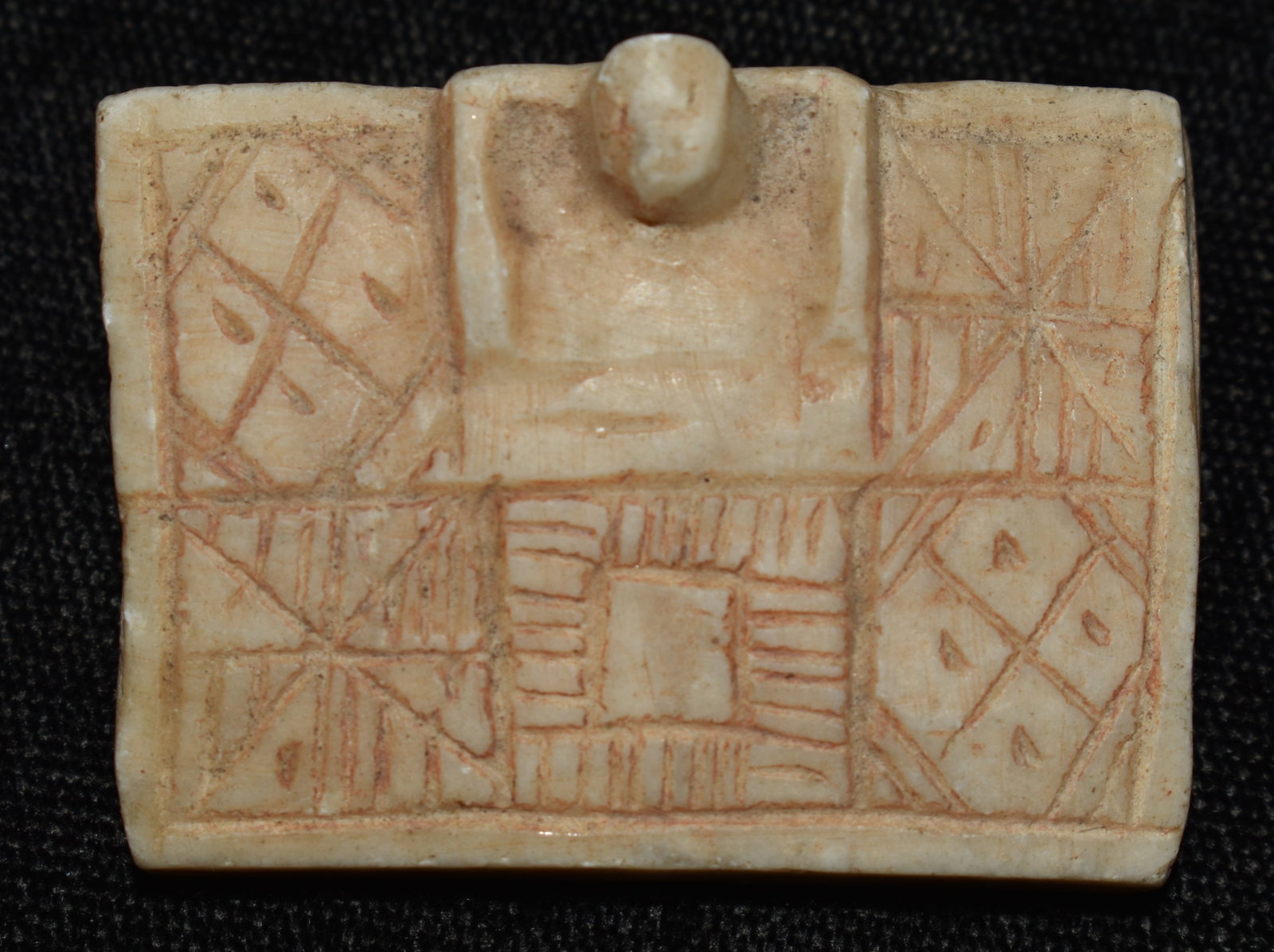Incan Stone Carving with Geometrical Designs - Interesting Artifact: Incan Stone Carving with Geometrical Designs. Found in the same region as the previous stone charm lots this carving likely has meaning. It depicts a person looming over or covered by the stone square