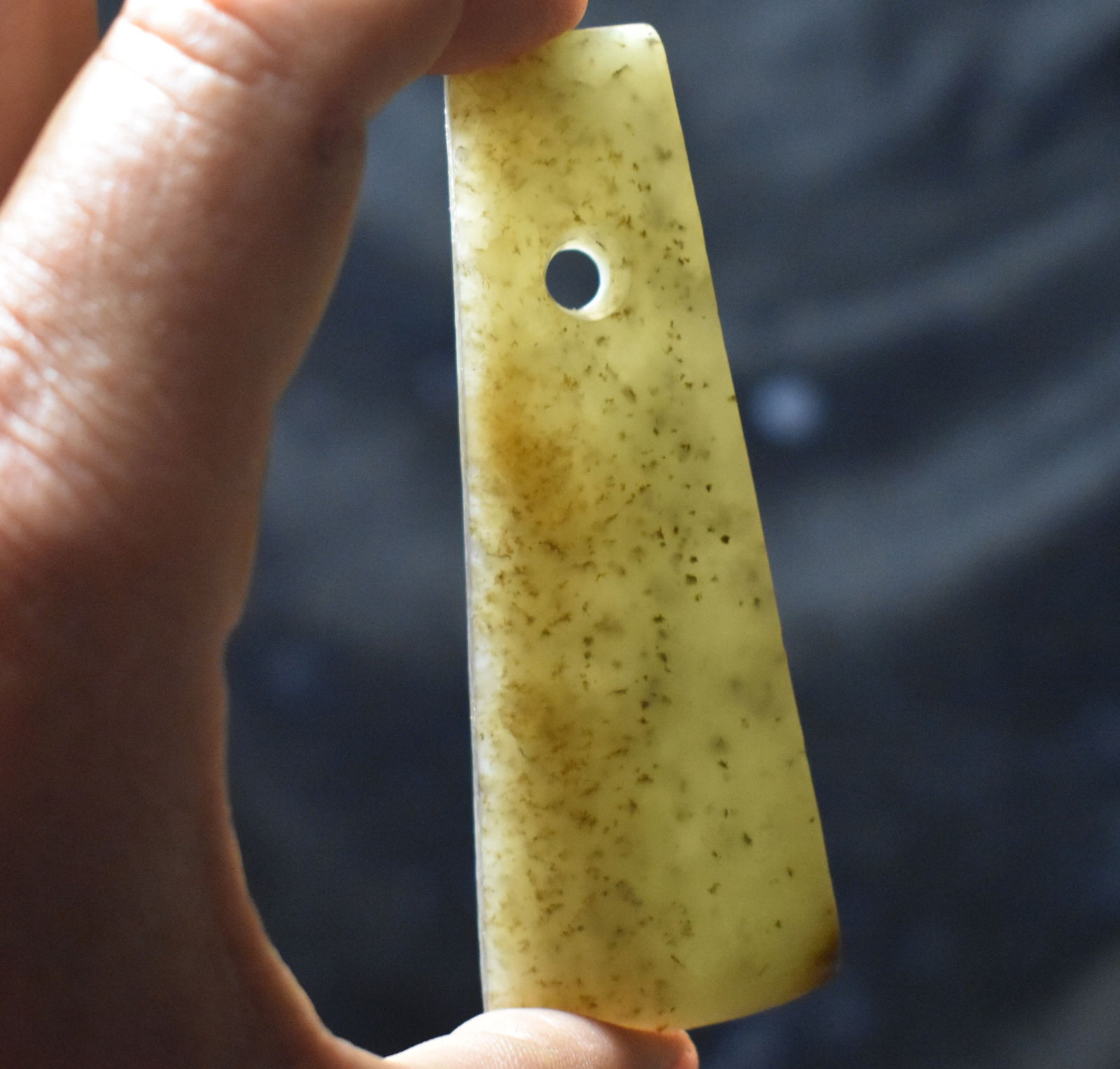 Semi-Transluscent Neolithic Jade Axe Pendant: Semi-Transluscent Neolithic Jade Axe Pendant. Made from a very attractive semi translucent green jade. Exhibits correct manufacture and good patination. Measures