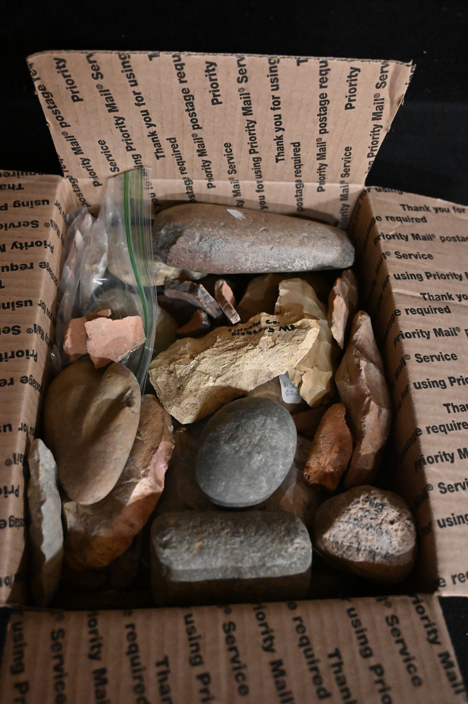 Box Full of Flint Tools, Celts, Axes, Pottery Shards, and Arrowheads.  Most are broke.  In a medium (1 of 4)