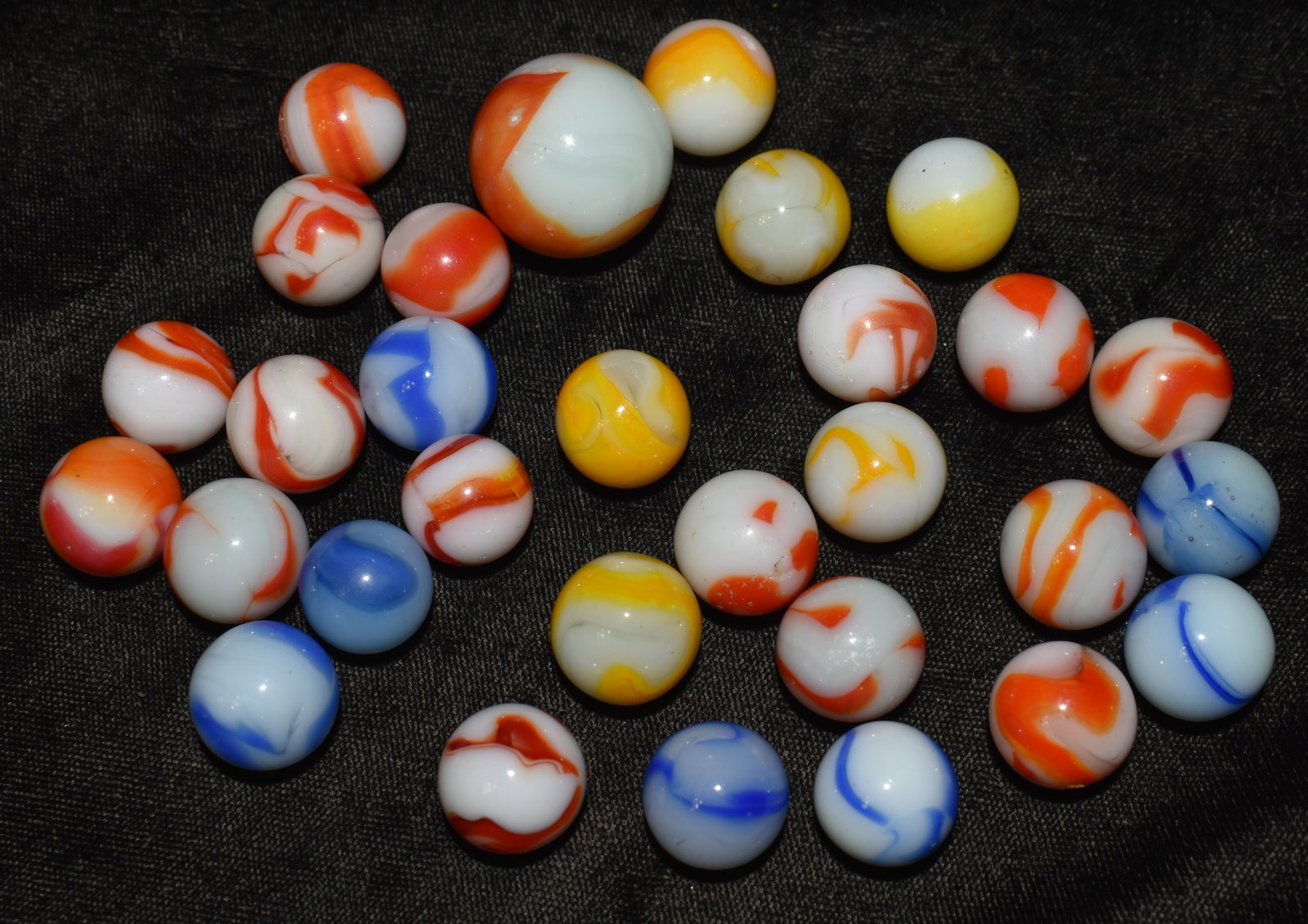 Lot of 30 Vintage Alox Marbles 1950's: Lot of 30 Alox Marbles 1950's. 30 Alox Marbles manufactured in St Louis, Mo. in the 1950's. 1 Shooters. 5/8" to 1" Shooter and most of these marbles are in great shape. Very few hit marks from play.