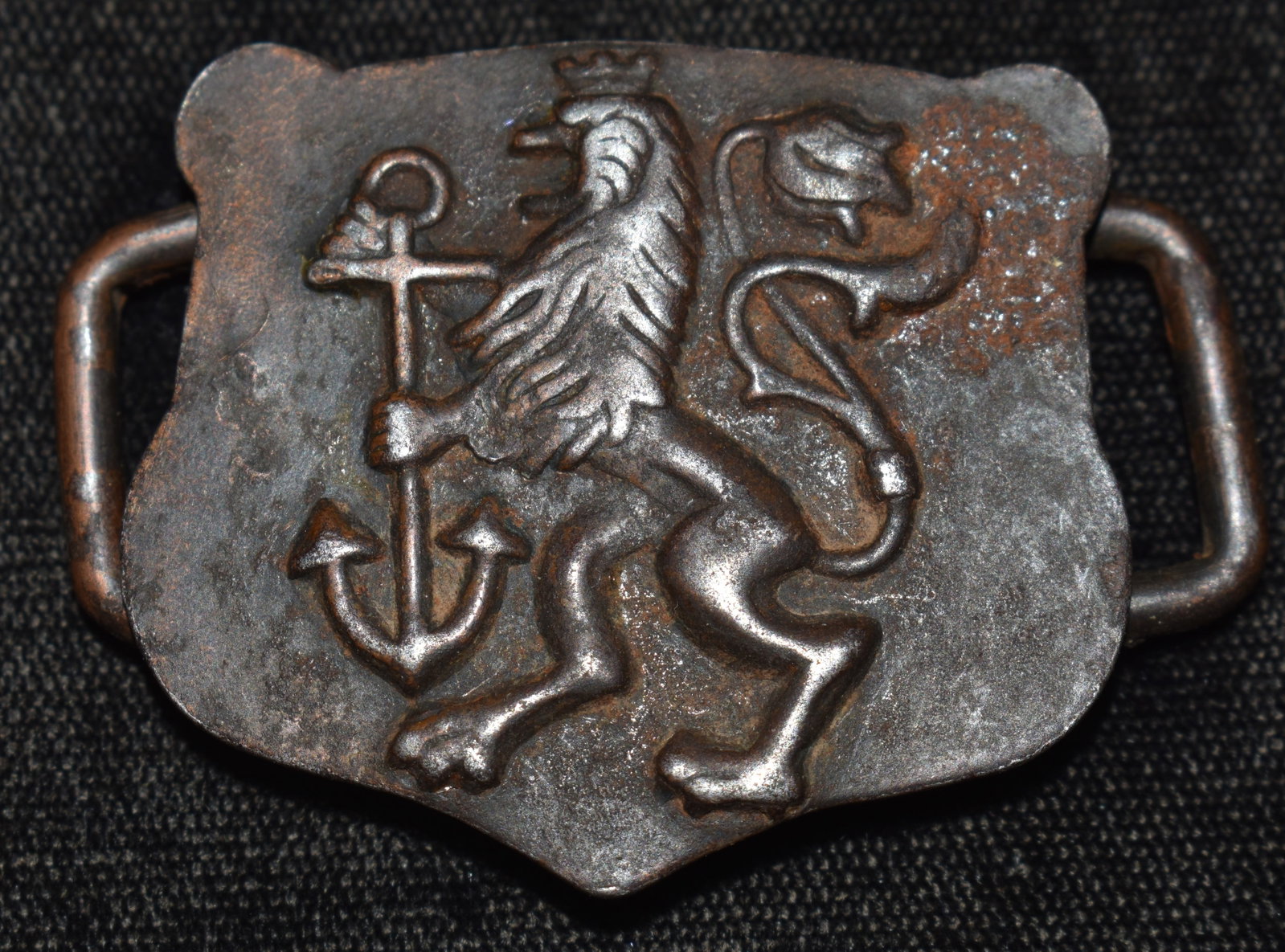 Very Old Minoan Griffon Naval Buckle: Very Old Minoan Griffon Naval Buckle. Griffon is raised on the metal by being pressed from the back side. We didn't find another buckle like this one to compare to on the web. The griffon and anchor h