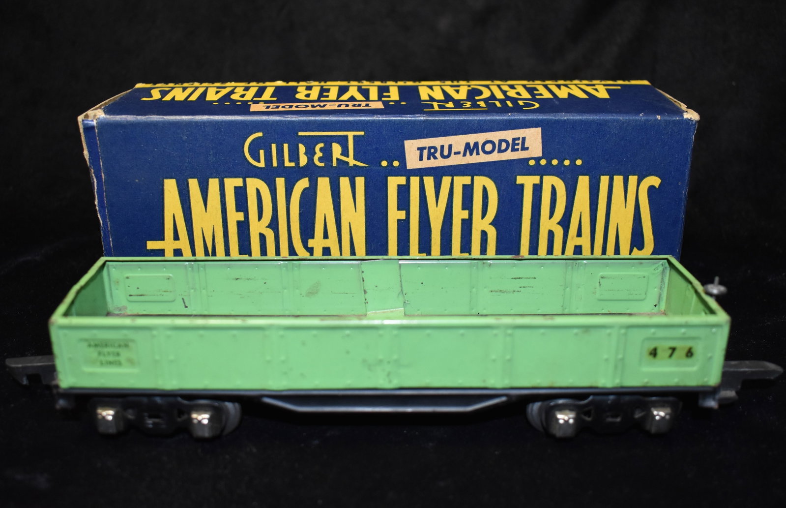 American Flyer 476 Pre-War O Gauge Gondola Car w/ Original Box 1938-1941: American Flyer 476 Pre-War O Gauge Gondola Car w/ Original Box 1938-1941. Good condition for its age. Could use a new paint job as shown in photos. Box is in good condition for its age. Measures 7 3/4