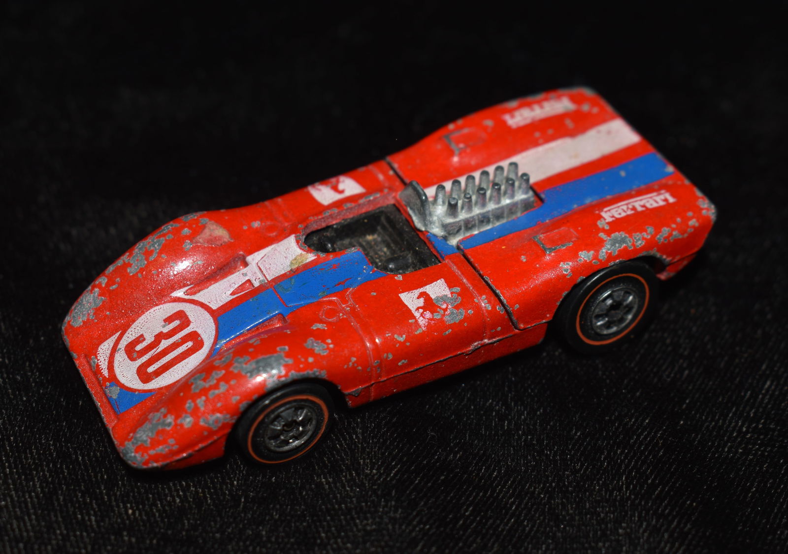 HOT WHEELS REDLINE 1969 FERRARI 312P RED CAR - Made in the USA: HOT WHEELS REDLINE 1969 FERRARI 312P RED CAR - Made in the USA. Missing its little wind shield and has some wear to the paint. Otherwise good condition.