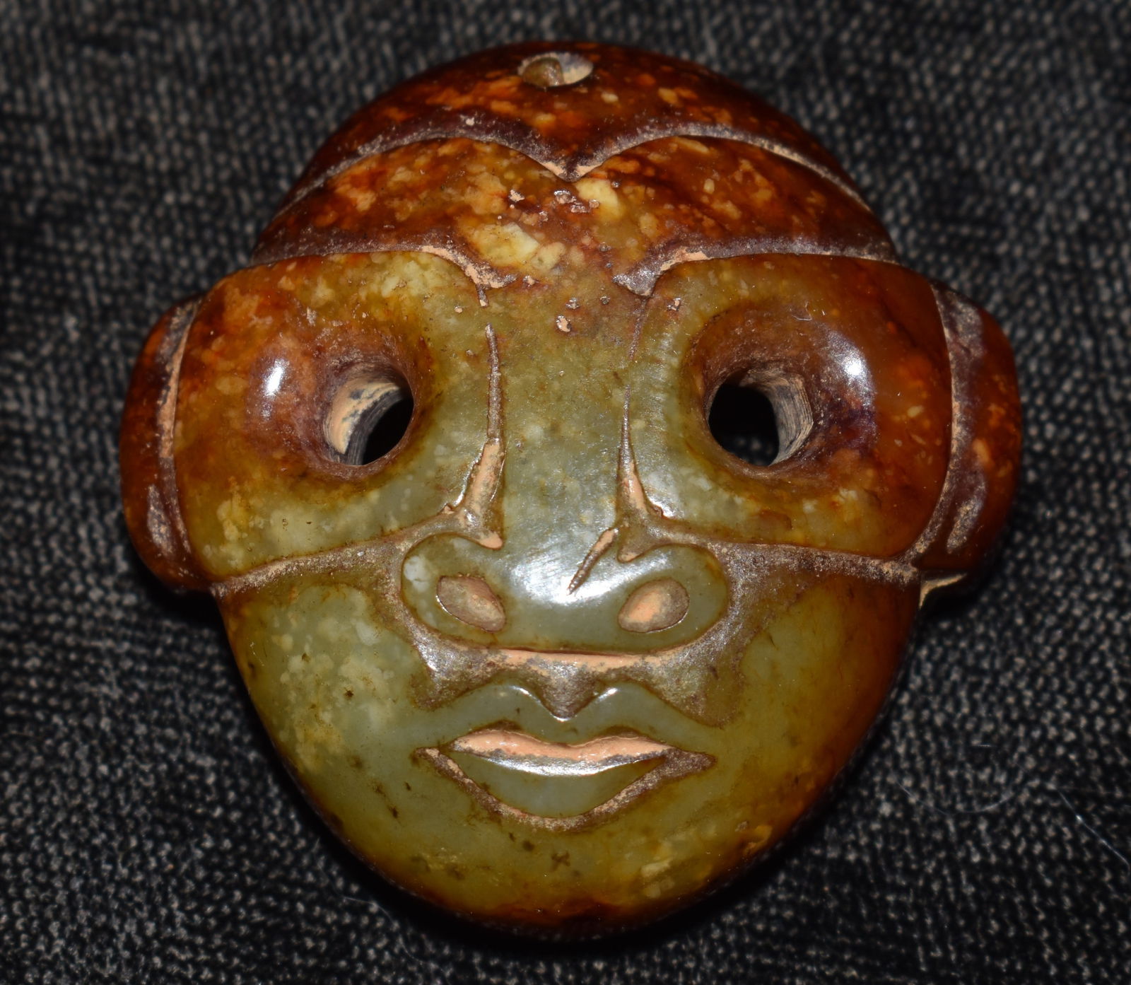 Highly Developed Neolithic Jade Mask Pendant found in Northern China: Highly Developed Neolithic Jade Mask Pendant found in Northern China. Demonstrates correct manufacture and patination. Very defined craftsmanship through use of ancient tools in manufacture. This pend