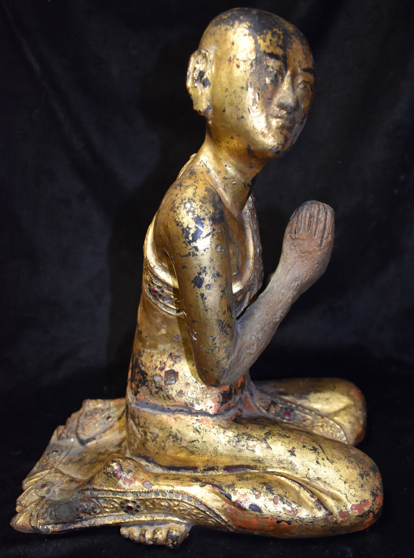 19th Century Burmese Gilt and Lacquered Buddha Disciple Sculpture: 19th Century Burmese Gilt and Lacquered Buddha Disciple Sculpture. Artisans of older Burmese statues often incorportated wood, plaster and stone in to their works. This is a nice example of early glas