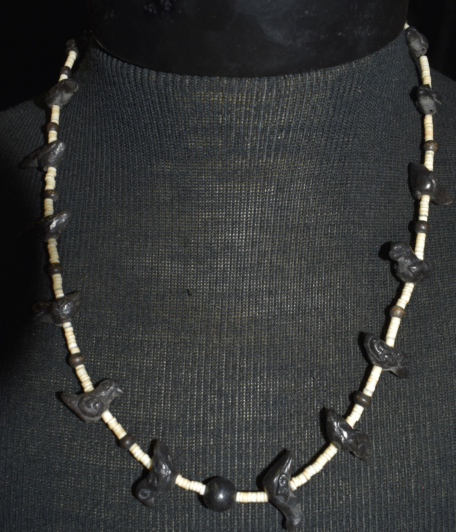 Vintage Navajo Hand Carved Heishi Bird Fetish Necklace 23": Vintage Navajo Hand Carved Heishi Bird Fetish Necklace. Carved from a jet black stone similar to obsidian (may be a form of obsidian). Smaller white beads are either shell or bone. Excellent condition