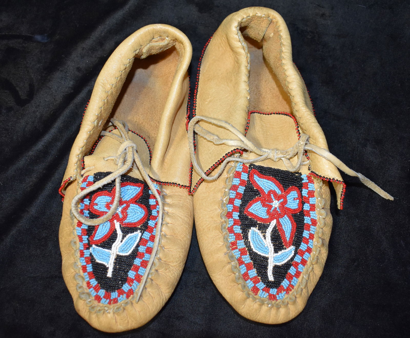 Late Century Plains Indian Beaded Moccisins - Native American: Late Century Plains Indian Beaded Moccisins - Native American. Nicely worn in excellent condition. Beadwork boldly expresses a floral motif. Leather is soft with good flexibility with minor wear to th