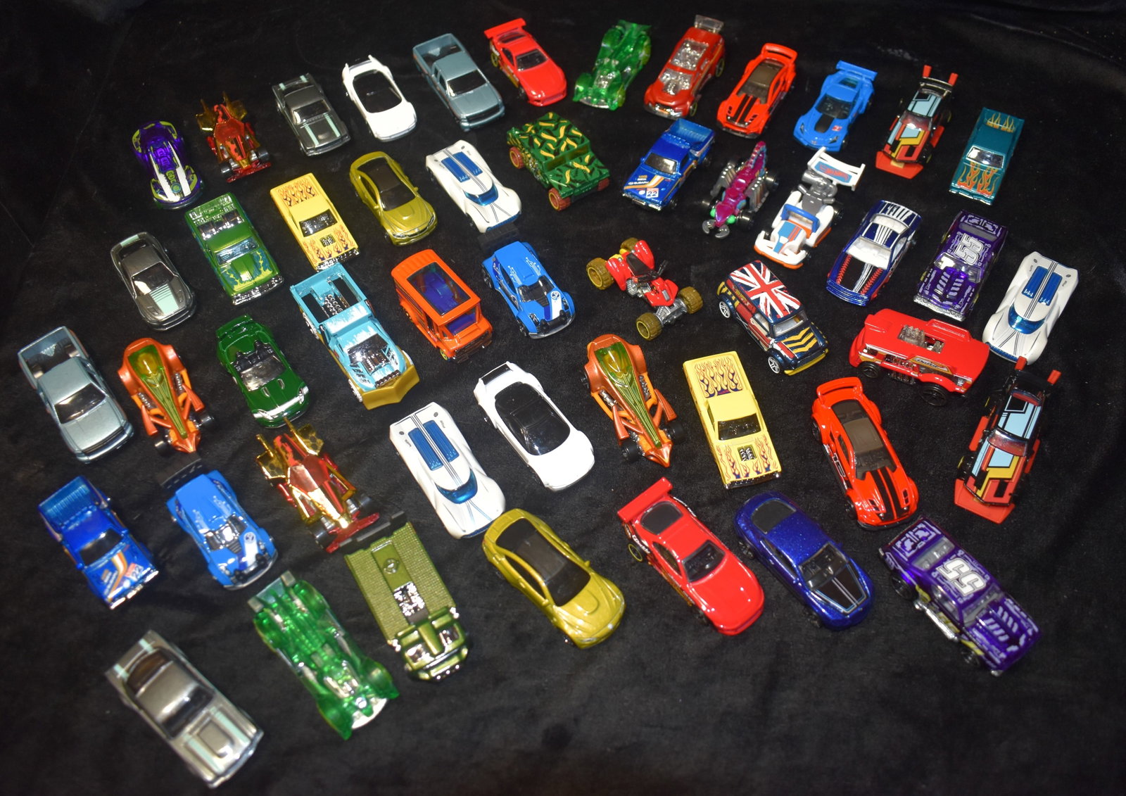 48 1/64 Scale Hot Wheels Diecast Cars: 48 Hotwheels. These are hotwheels that havnt been played with. Likely fell out or were removed from their packages when they were in a store. Dates noticed on the bottom of the cars were 2010 to 2014.