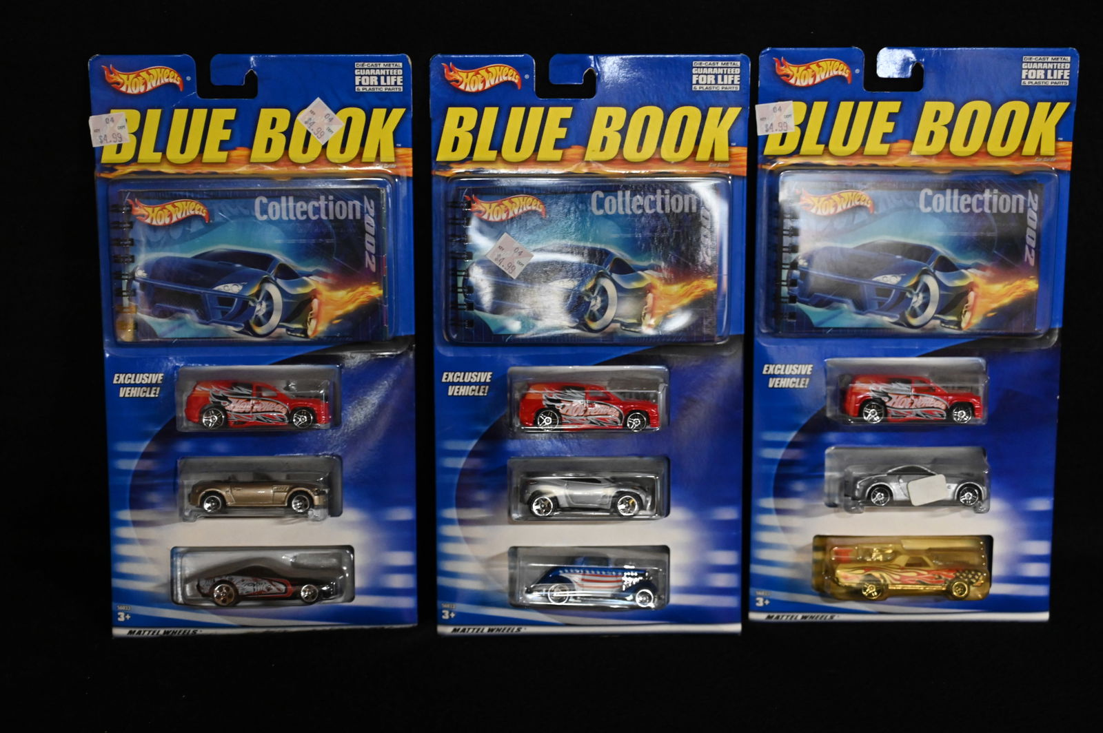 3 Hotwheels 2002 Blue Book Collection 3 Car Pack with a Limited Edition Blue Book which is a (1 of 5)