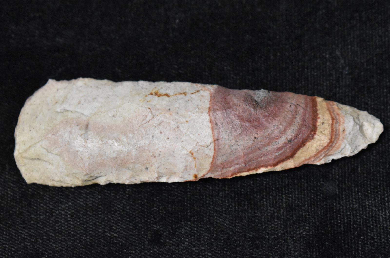 3 3/8" Highly Developed Colorful End scraper found in Johnson County, Missouri: 3 3/8" Highly Developed Colorful End scraper found in Johnson County, Missouri. It's rare to see an end scraper as nice as this one. Very nice large example of the type. Ex Tim Patrick Collection. Key