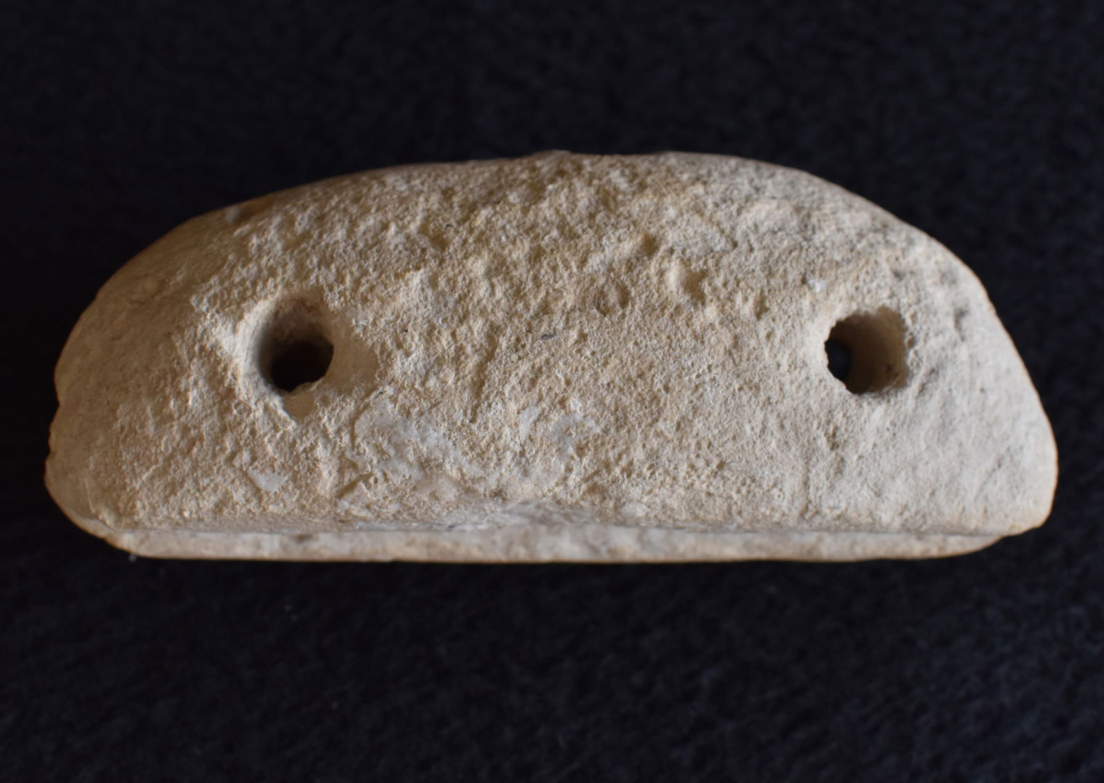Pre-Columbian Boatstone or Bannerstone: Pre-Columbian Boatstone or Bannerstone. This is a weird artifact. We havnt seen one quite like it. Boatstone or Bannerstone is just a guess. Open to interpretation. Has 2 holes drilled through the cen