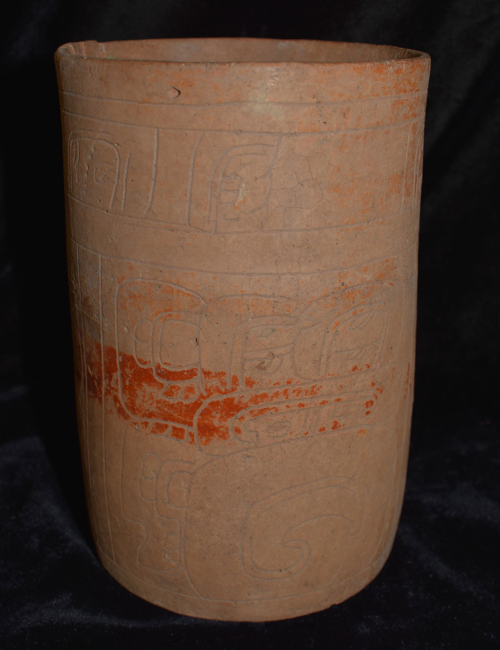 Pre-Columbian Mayan Highly Engraved Cylinder Vase Circa 500 to 700 AD: Pre-Columbian Mayan Highly Engraved Cylinder Vase Circa 500 to 700 AD. Very ornate piece. Stress fractures to the base w/ one glued section on one side of the rim as shown in photos. Ex. Harve Thorn C