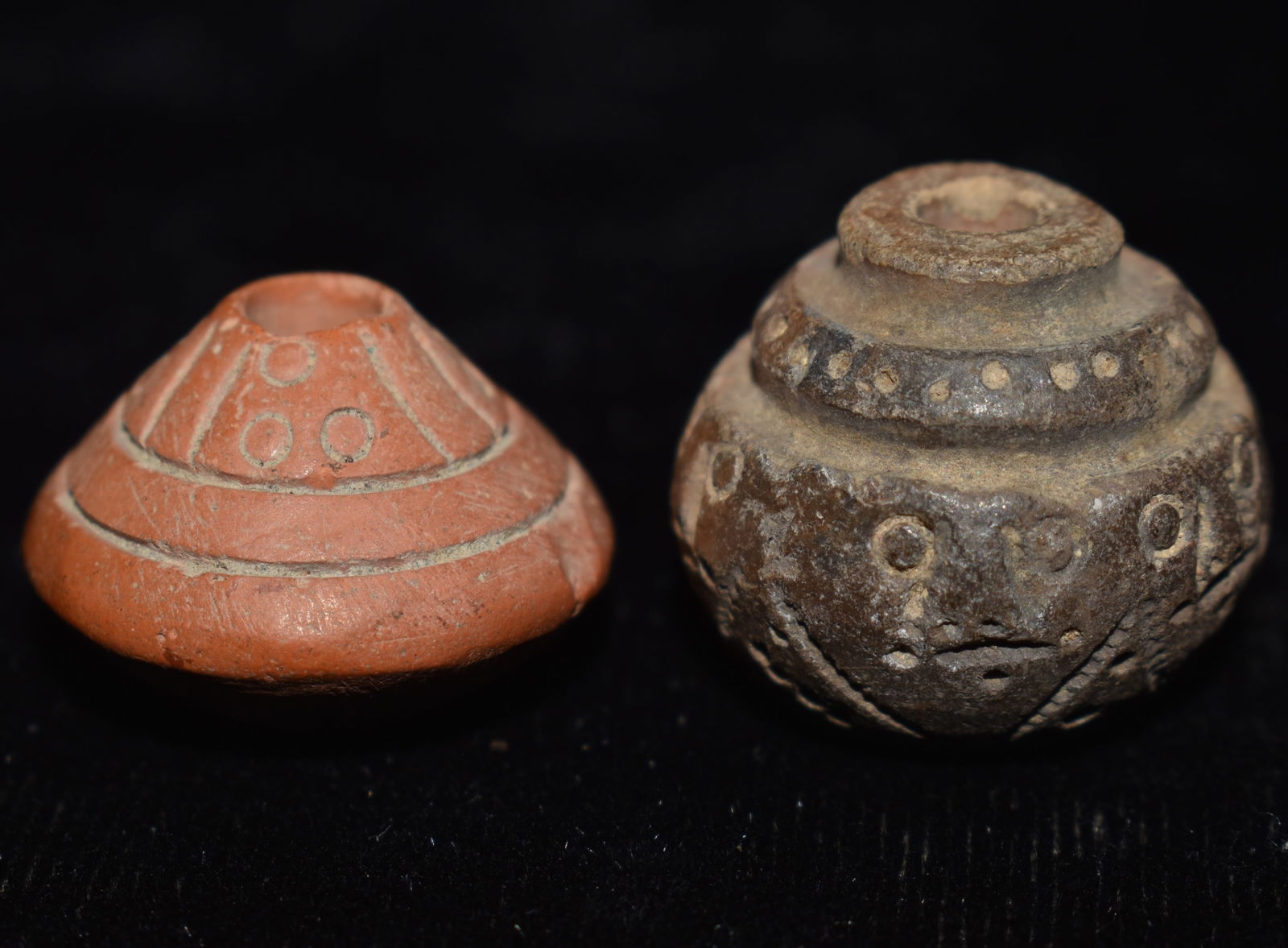 2 Highly Engraved Pre-Columbian Spindle Whorl Beads: 2 Highly Engraved Pre-Columbian Spindle Whorl Beads. Both are outstanding examples. They both measure approximately 3/4" Diameter. From the Chuck and Eileen Hoffman Collection. Chuck and his wife spen