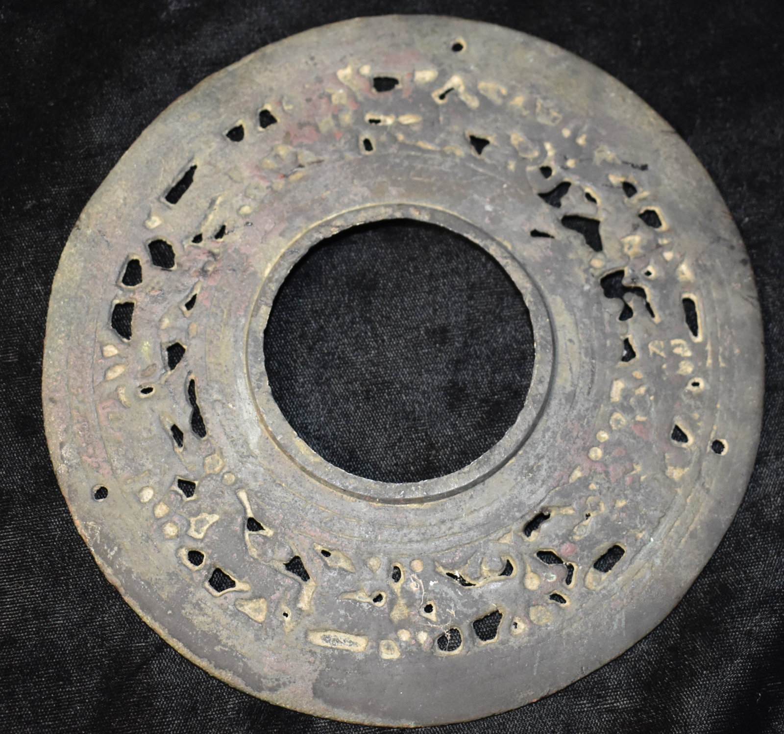 10th to 12th Century Indo-Persian Bronze Highly Detailed Artistic Animorphic Disc: 10th to 12th Century Indo-Persian Bronze Highly Detailed Artistic Animorphic Disc. Highly detailed bronze depicting animals circling clockwise. 3 small holes around the edge suggest this was attached 