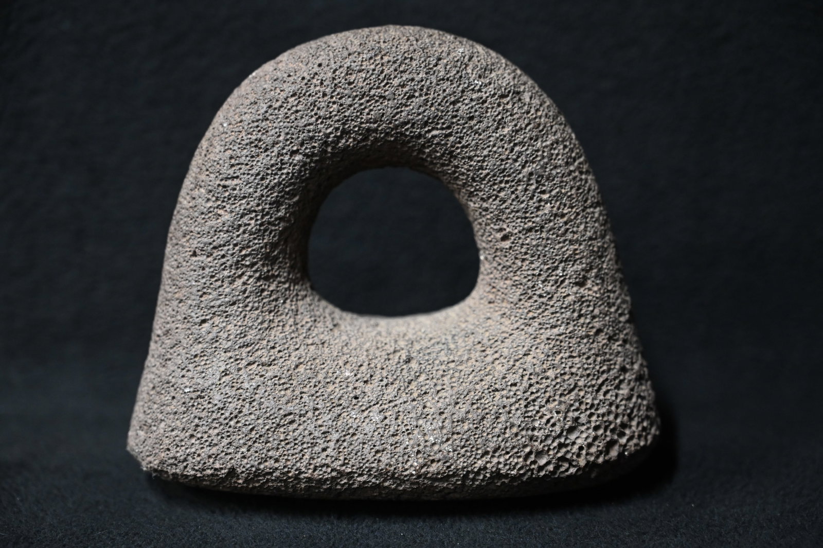 5 1/8" Basalt Ring Poi Pounder Found in Kauai, Hawaii. 6" wide. Made from a basalt material. Poi: 5 1/8" Basalt Ring Poi Pounder Found in Kauai, Hawaii. 6" wide. Made from a basalt material. Poi is a traditional staple food in the Polynesian diet, made from taro. Traditional poi is produced by mas