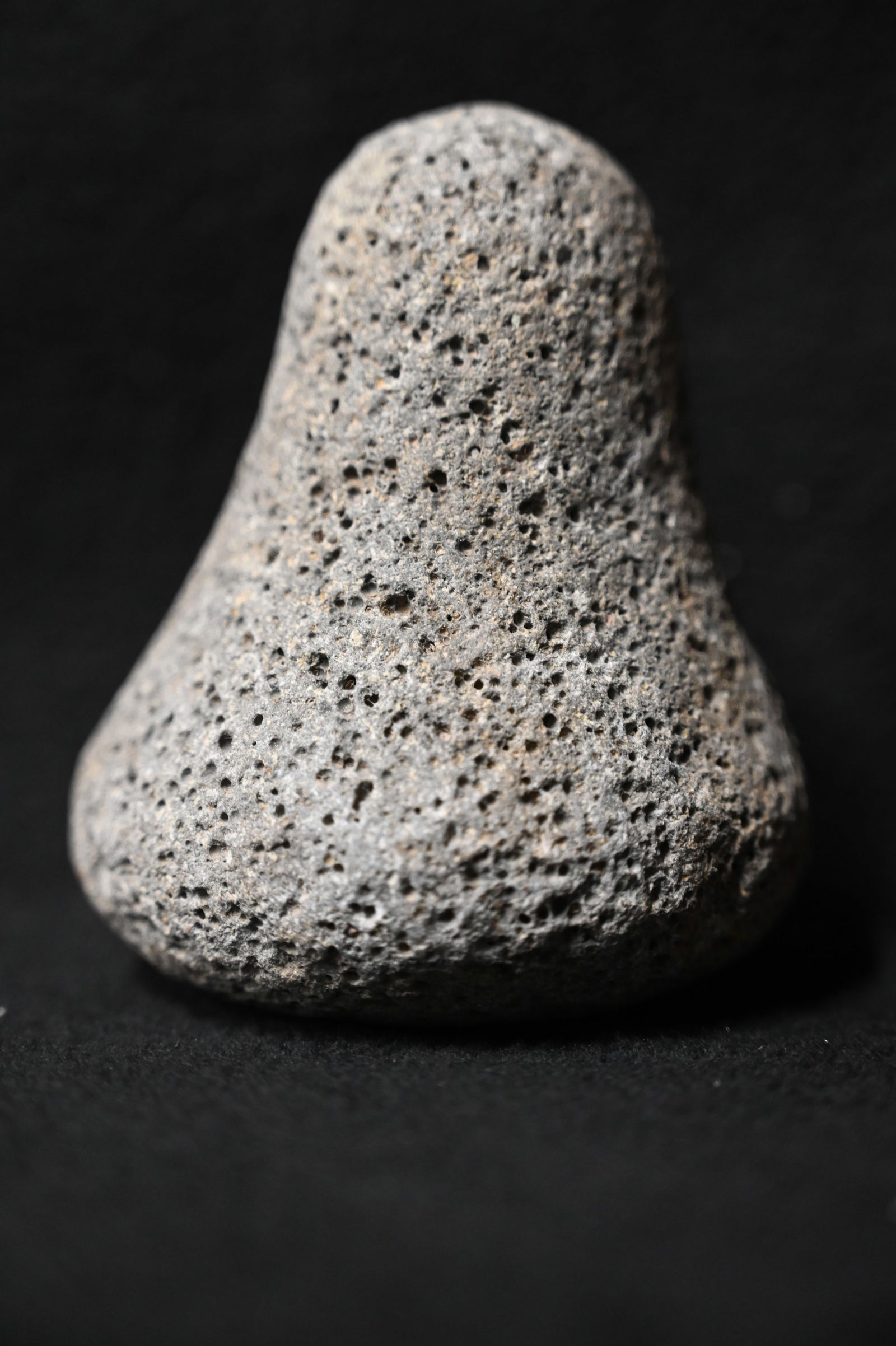 3 3/4" Poi Pounder Found in the Polynesian Islands Region 3 1/8" wide. Made from a basalt material.: 3 3/4" Poi Pounder Found in the Polynesian Islands Region 3 1/8" wide. Made from a basalt material. Poi is a traditional staple food in the Polynesian diet, made from taro. Traditional poi is produced