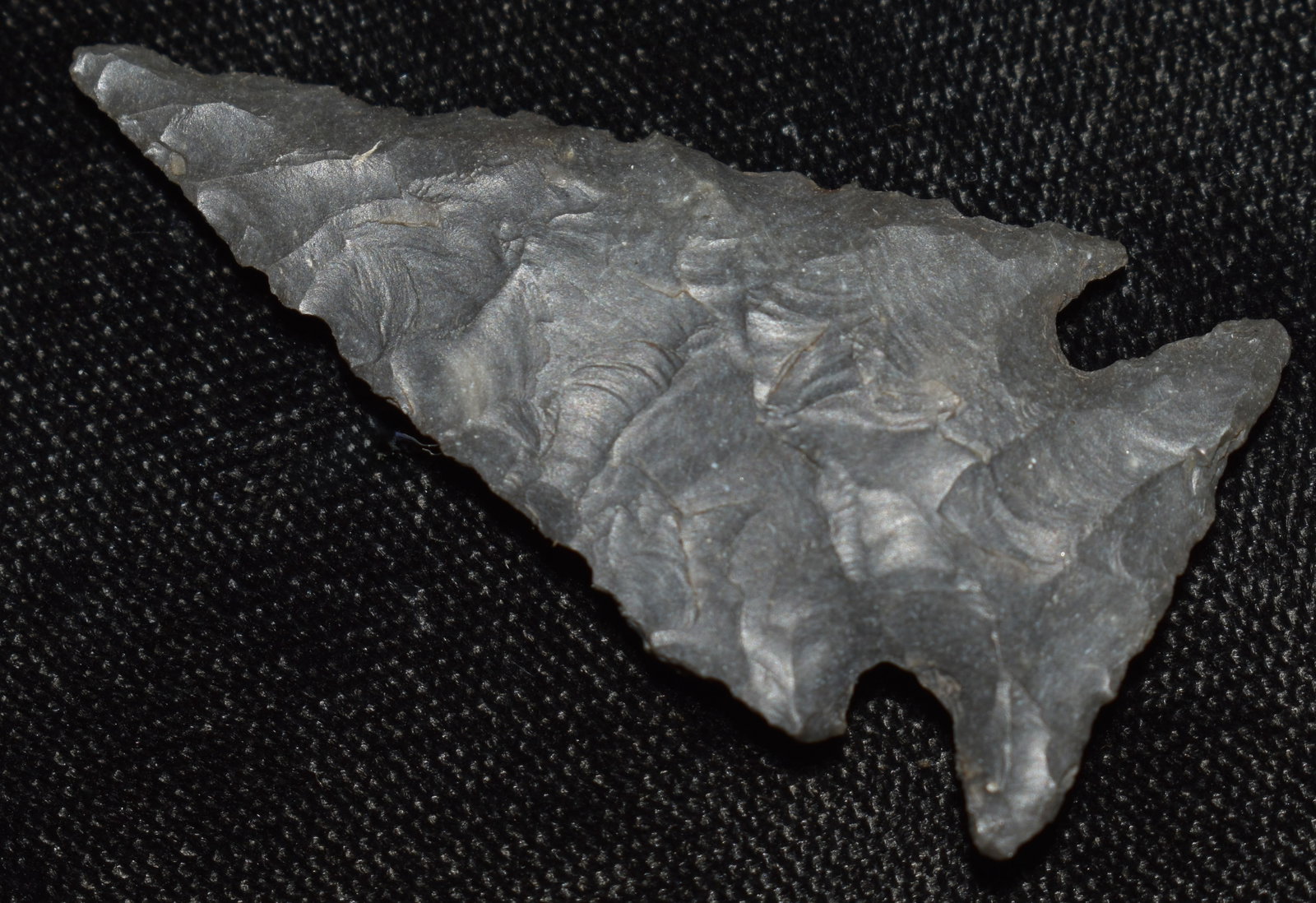 1 7/8" Finely Made Ensor Arrowhead found in Texas - Ex Walt McIntyre Collection: 1 7/8" Finely Made Ensor Arrowhead found in Texas - Ex Walt McIntyre Collection. Correct manufacture and good patination. Material appears to be the dark chert found along the Perdernales River.