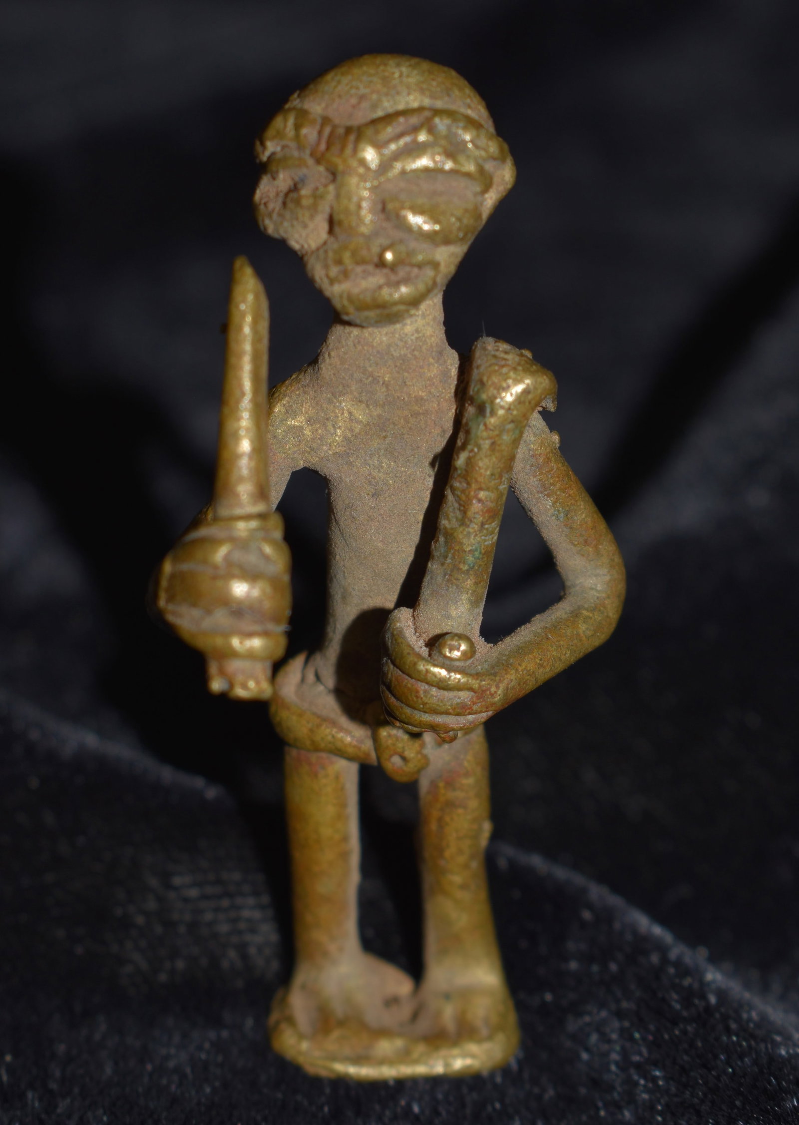 14th to 19th Century Akan Ashanti Bronze Gold Weight from Ghana, Africa: Akan Ashanti Bronze Gold Weight from Ghana, Africa. Rare African Metal Sculpture / Figurine. Man with Digging Tools Gold Weight. Akan Ashanti gold weights, also known as mrammou or abrammuo, were prim