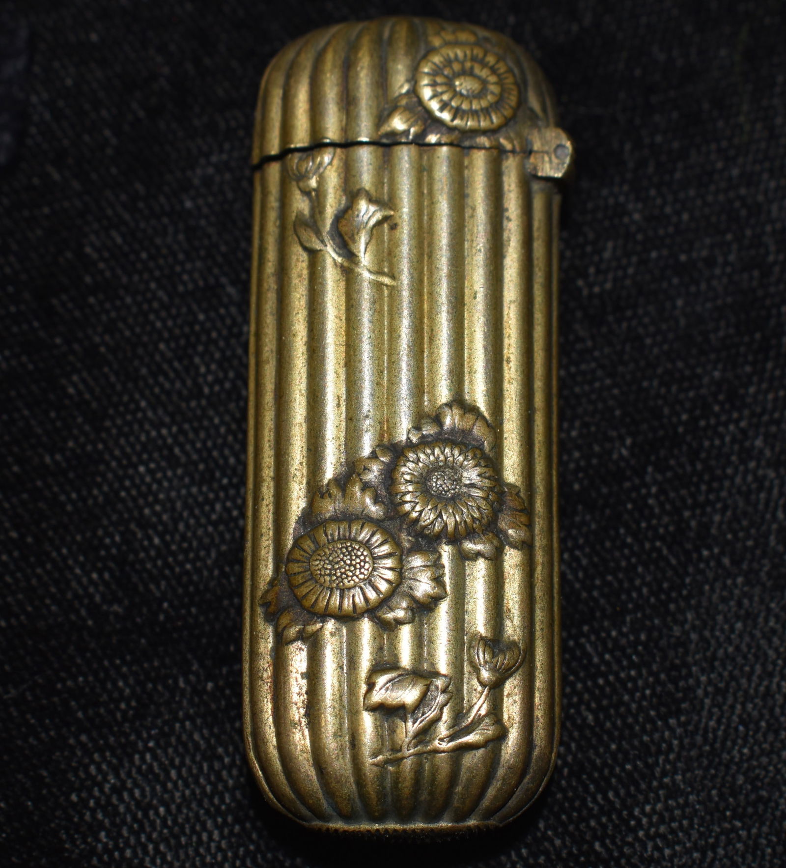 19th Century Metal Match, Needle, Snuff or Trinket Box: 19th Century Metal Match, Needle, Snuff or Trinket Box. We didn't find a close match to this piece on a visual search on the web. It is without question quite old appearing to be Victorian with the fl