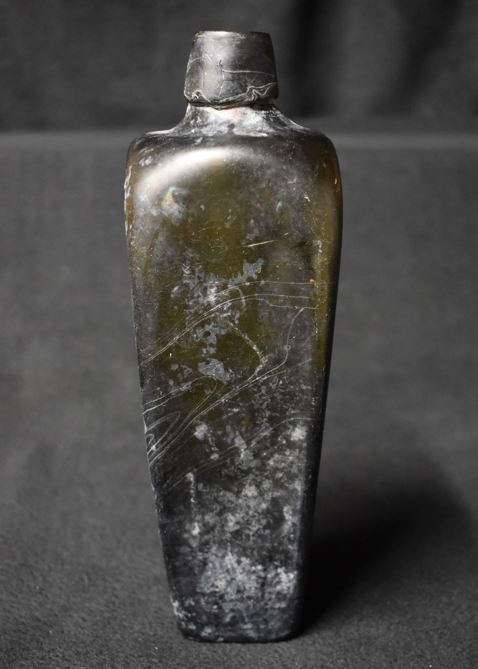 1870's British Black Gin Pirate Bottle: 1870's British Black Gin Pirate Bottle. This color was used due to the high tax rates in England on clear glass at the time. Excellent condition. All original with no restoration. Measures 9 1/2"