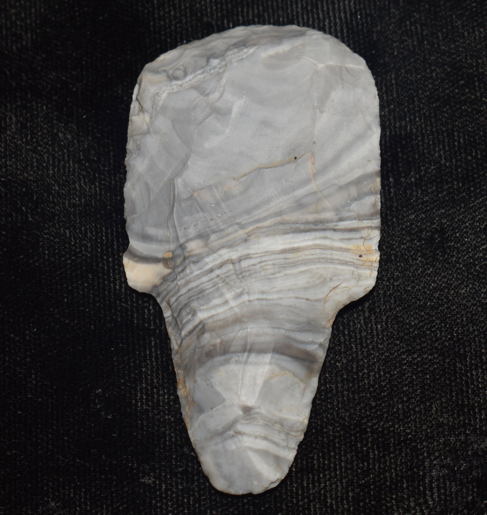 Outstanding Adena Dickson End scraper made of Banded Mozarkite found in Johnson County, Missouri: Outstanding Adena Dickson End scraper made of Banded Mozarkite found in Johnson County, Missouri. A rare form for this point type. Exhibits correct manufacture and good patination. Ex Tim Patrick Coll