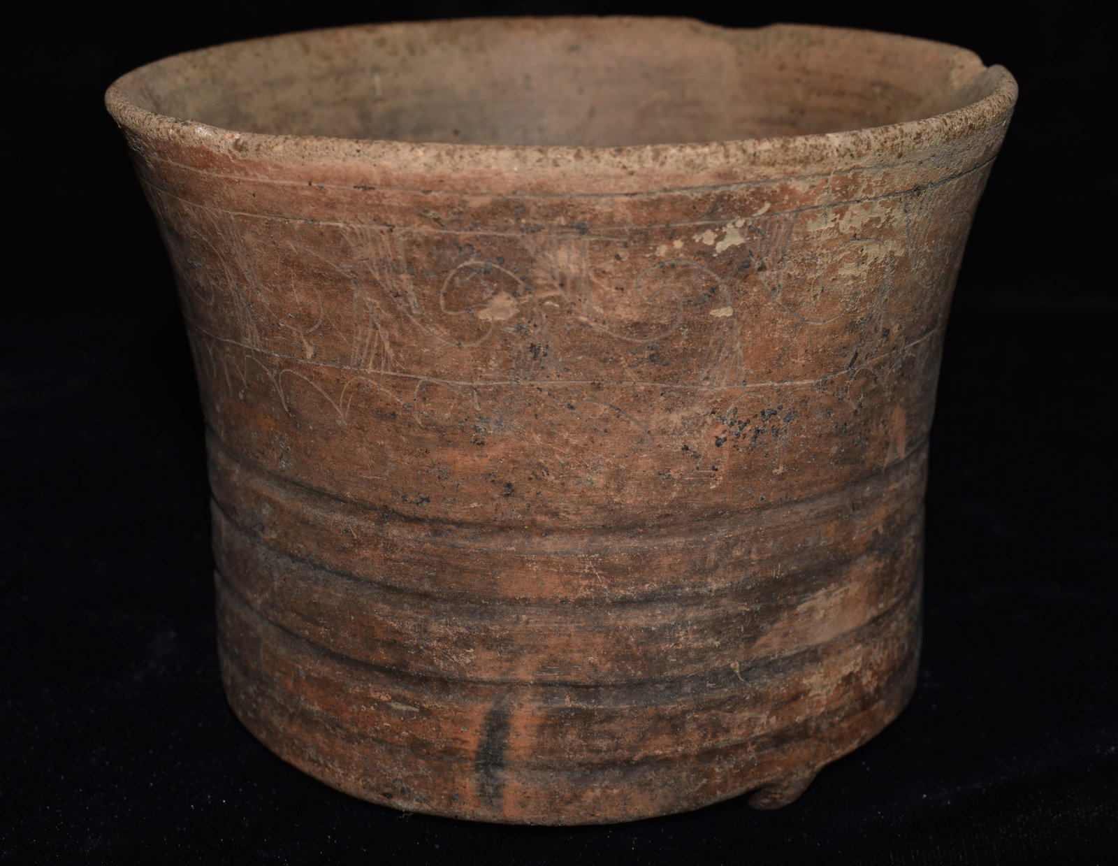 Pre-Columbian Mayan Incised Polychrome Pottery Vessel: Pre-Columbian Mayan Incised Polychrome Pottery Vessel. Three small legs on the base with incised rings around the outside of the vessel. Exhibits correct manufacture and excellent patination. Solid po