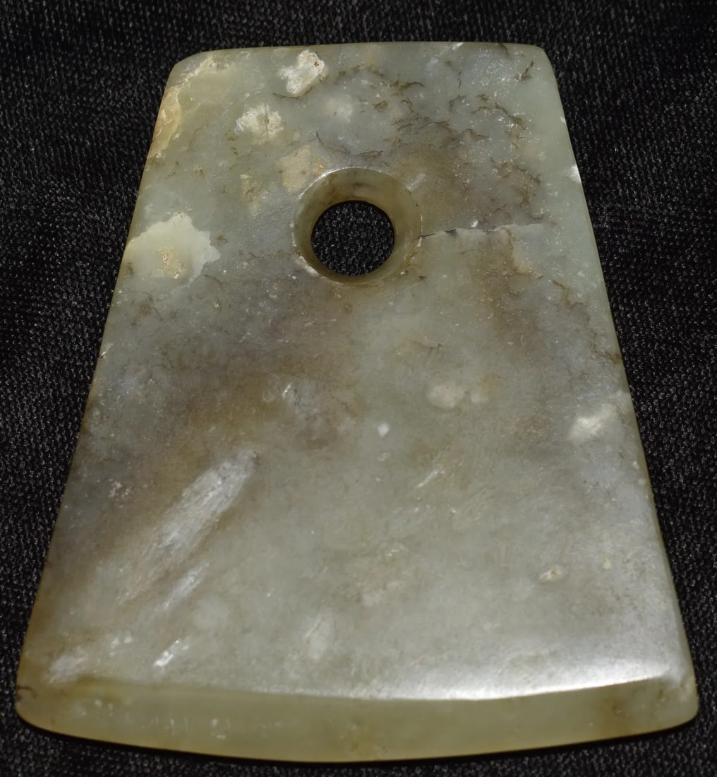 2 7/8" Jade Axe Pendant found in Liaoning Province Northeast China: 2 7/8" Jade Axe Pendant found in Liaoning Province Northeast China. The collector that acquired this one said it is Post-Neolithic. Not sure how he could tell as it looks good under a microscope. Anci