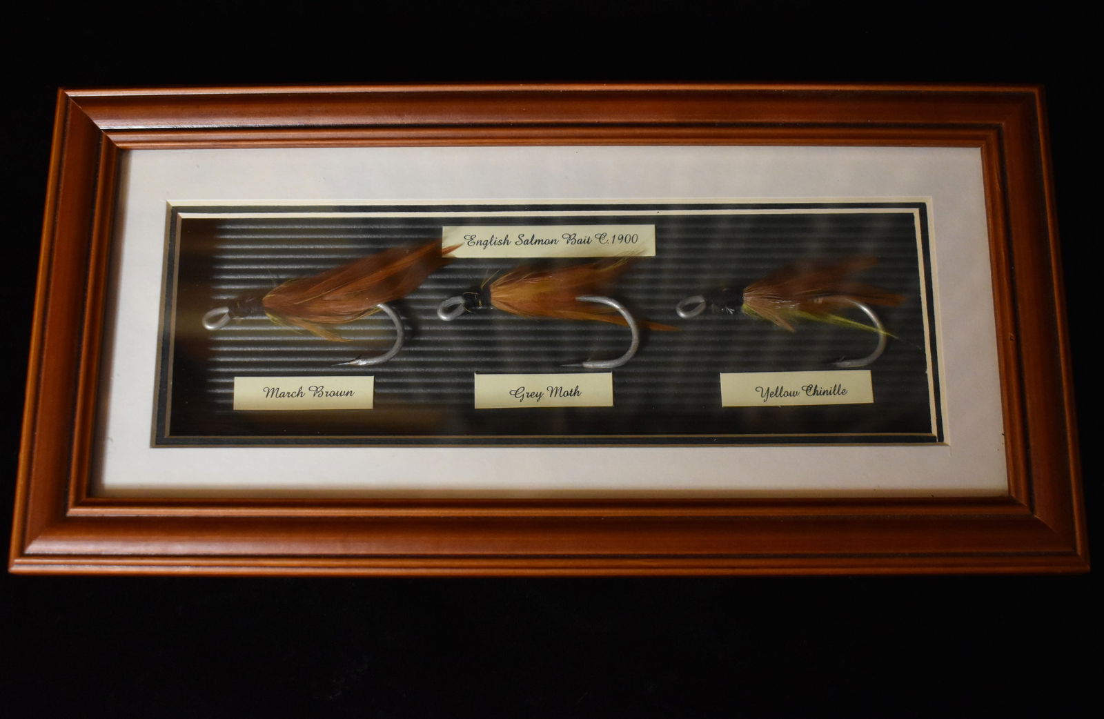 Vintage English Salmon Bait C. 1900 - 3 Fishing Lure Hooks in a Shadow Box Frame: Vintage English Salmon Bait C. 1900 - 3 Fishing Lure Hooks in a Shadow Box Frame. Displays 3 popular fishing lures used in England circa 1900. Lure names are March Brown, Gray Moth and Yellow Chinille