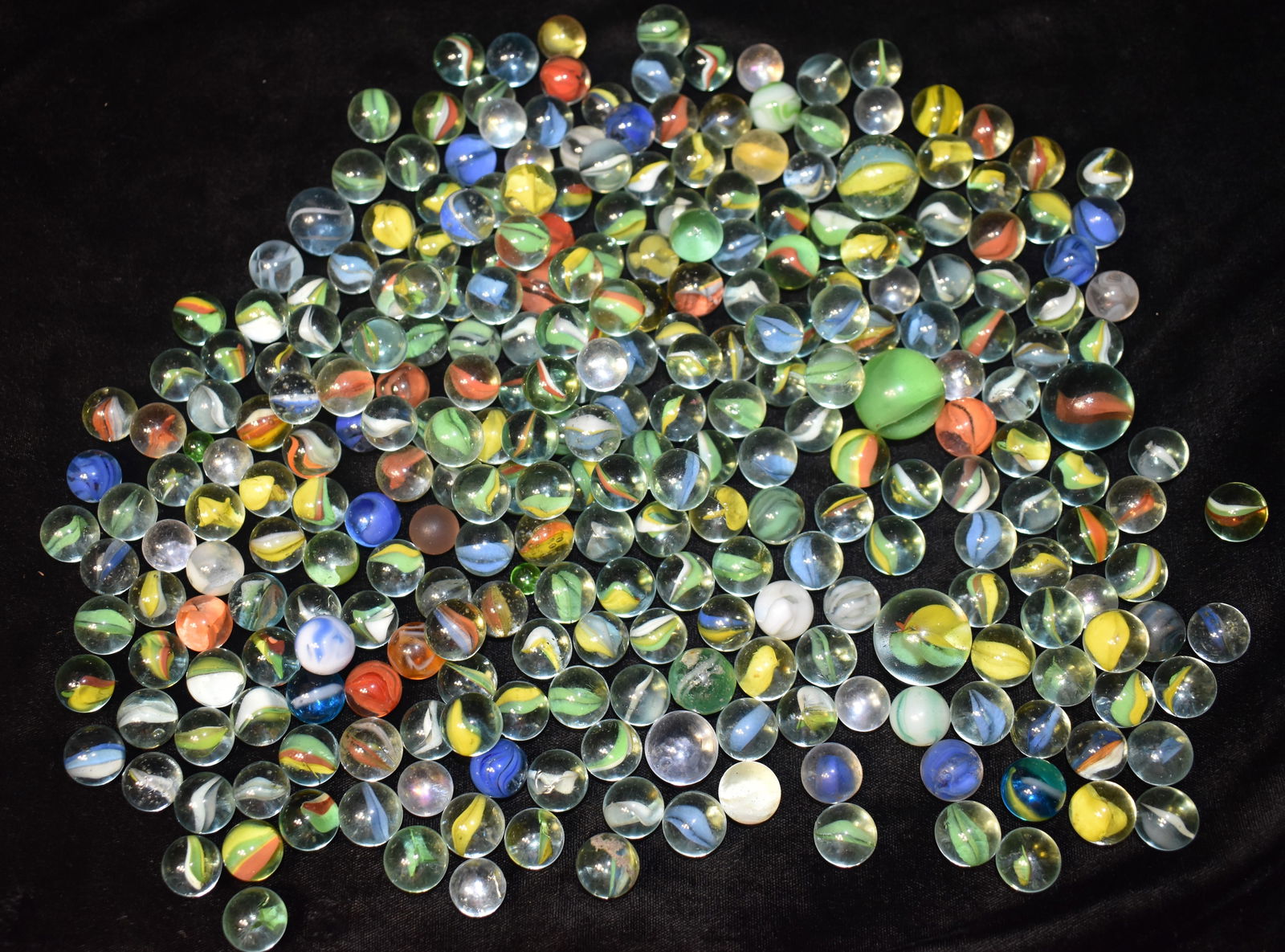 Over 5 Pounds of Vintage Cats Eye Marbles: Over 5 Pounds of Vintage Cats Eye Marbles. Noticed a few marbles that weren't cats eyes. Some will have a hit mark here and there. To many marbles to inspect. Measure approximately 5/8" to 1" Diameter