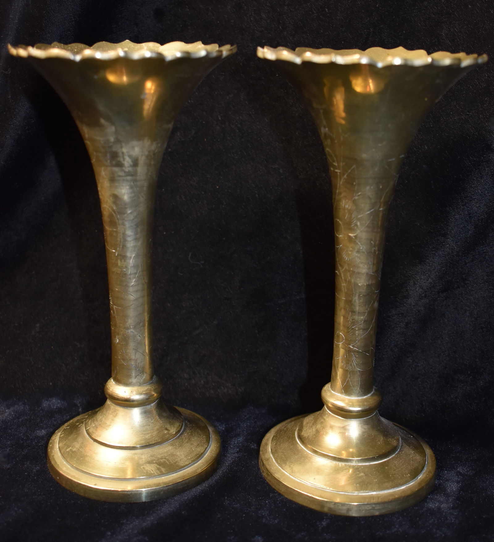 2 Vintage Matching Brass Engraved Candle Holders - Indo-Persian: 2 Vintage Matching Brass Candle Holders. Some hand engraving around the stems suggesting these are Indo-Persian in origin. From the Chuck and Eileen Hoffman Collection. They measure approximately 7 1/