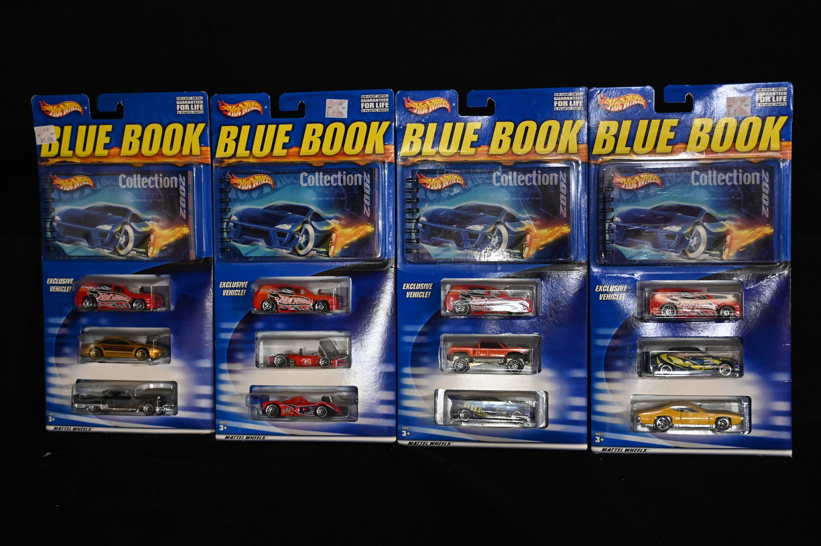 4 Hot wheels 2002 Blue Book Collection 3 Car Pack with a Limited Edition Blue Book which is a: 4 Hot wheels 2002 Blue Book Collection 3 Car Pack with a Limited Edition Blue Book which is a reference for all the new Hot Wheels cars of 20002. Manufactured in 2001 and in brand new unopened conditi
