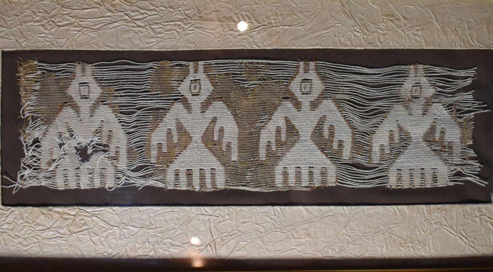 Nasca Ornithomorphic Embroidery Made by the Nasca 200 BCE to 600 CE: Nasca Ornithomorphic Embroidery Made by the Nasca 200 BCE to 600 CE. Colorful example of the traditional textiles made by the Nasca people. Made of camelid fibre and cotton. Nicely framed long ago. Th