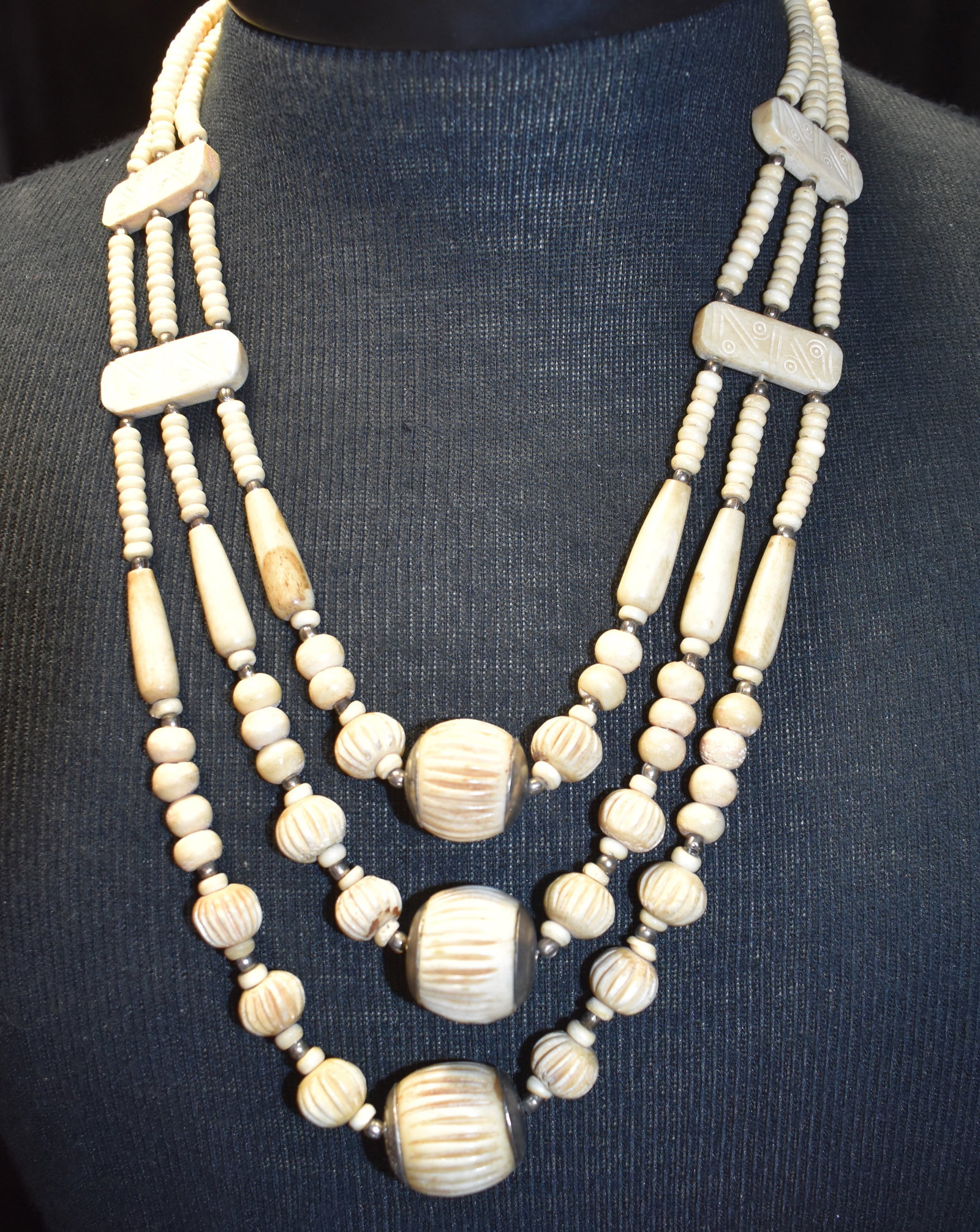 Vintage Indian Bone Charm Bead Necklace: Vintage Indian Bone Charm Bead Necklace. Beads are hand crafted from bone. Some beads have patterning or inscription of sorts as shown in photos. Collected in either Tibet or India by Chuck & Eileen H