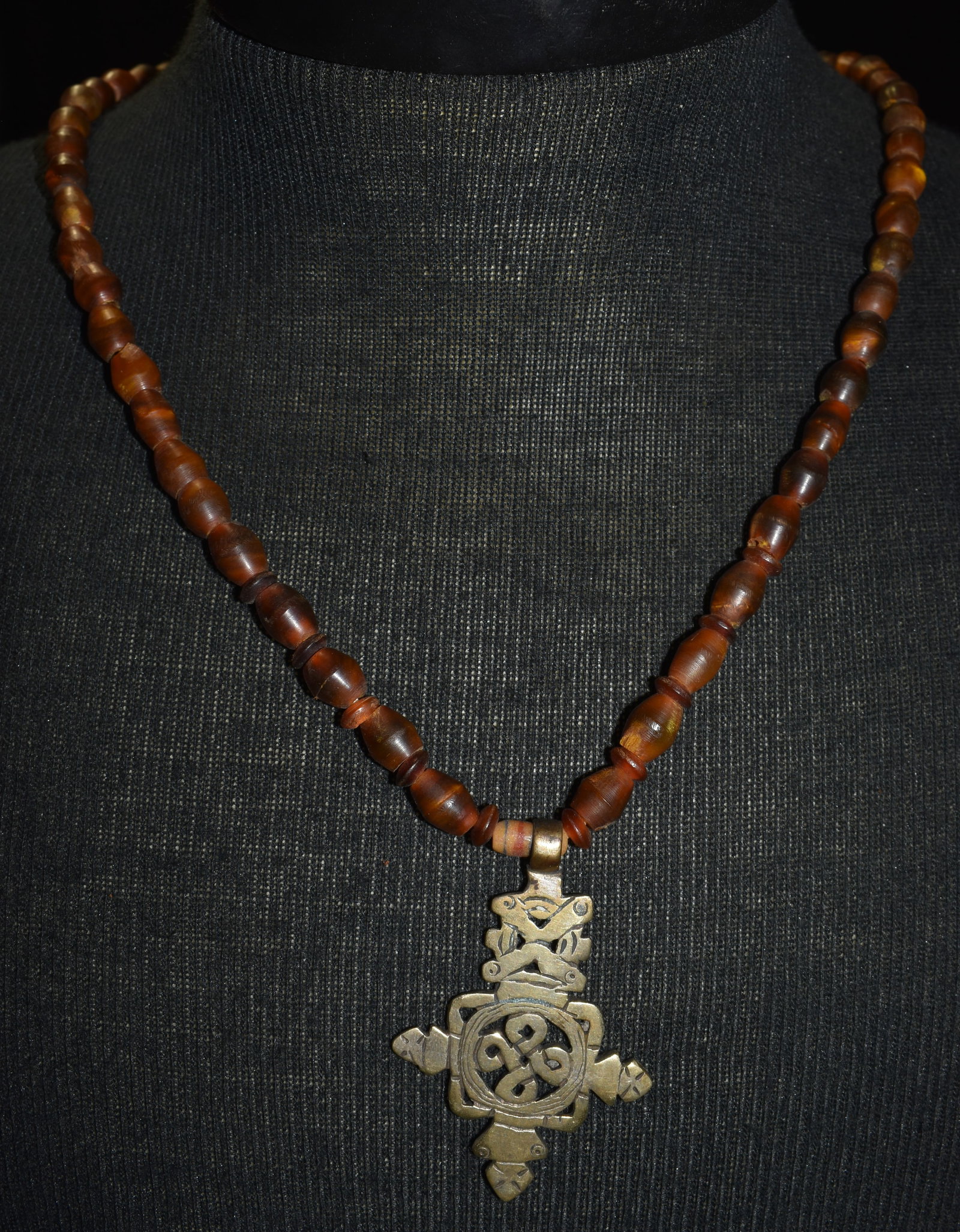 Vintage Ethiopian Silver Cross Pendant on Horn Bead Necklace - 26": Vintage Ethiopian Silver Cross Pendant on Horn Bead Necklace. Ethiopians used to melt their currency to make these crosses and the percent silver in the coins was The Coptic crosses, deeply revered in