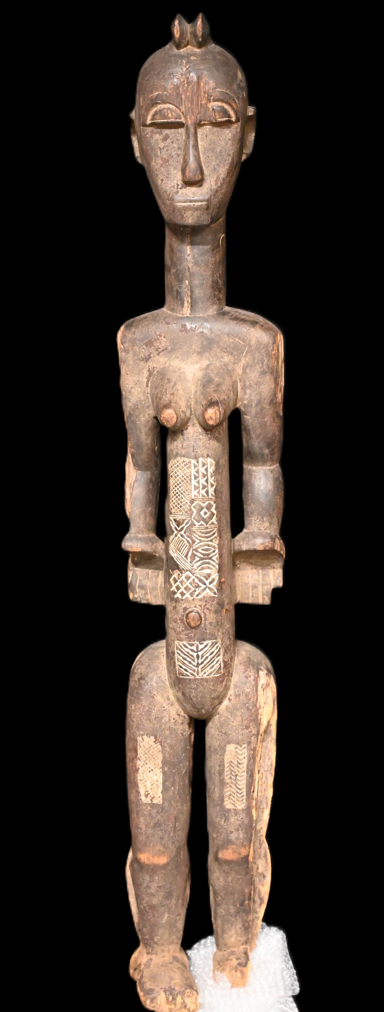46" Dogon Standing Female Fertility Statue Hand Carved Wood with exceptional wear and aging. This: 46" Dogon Standing Female Fertility Statue Hand Carved Wood with exceptional wear and aging. This is an old artifact not a reproduction for tourists. Comes from Africa in the Niger area.