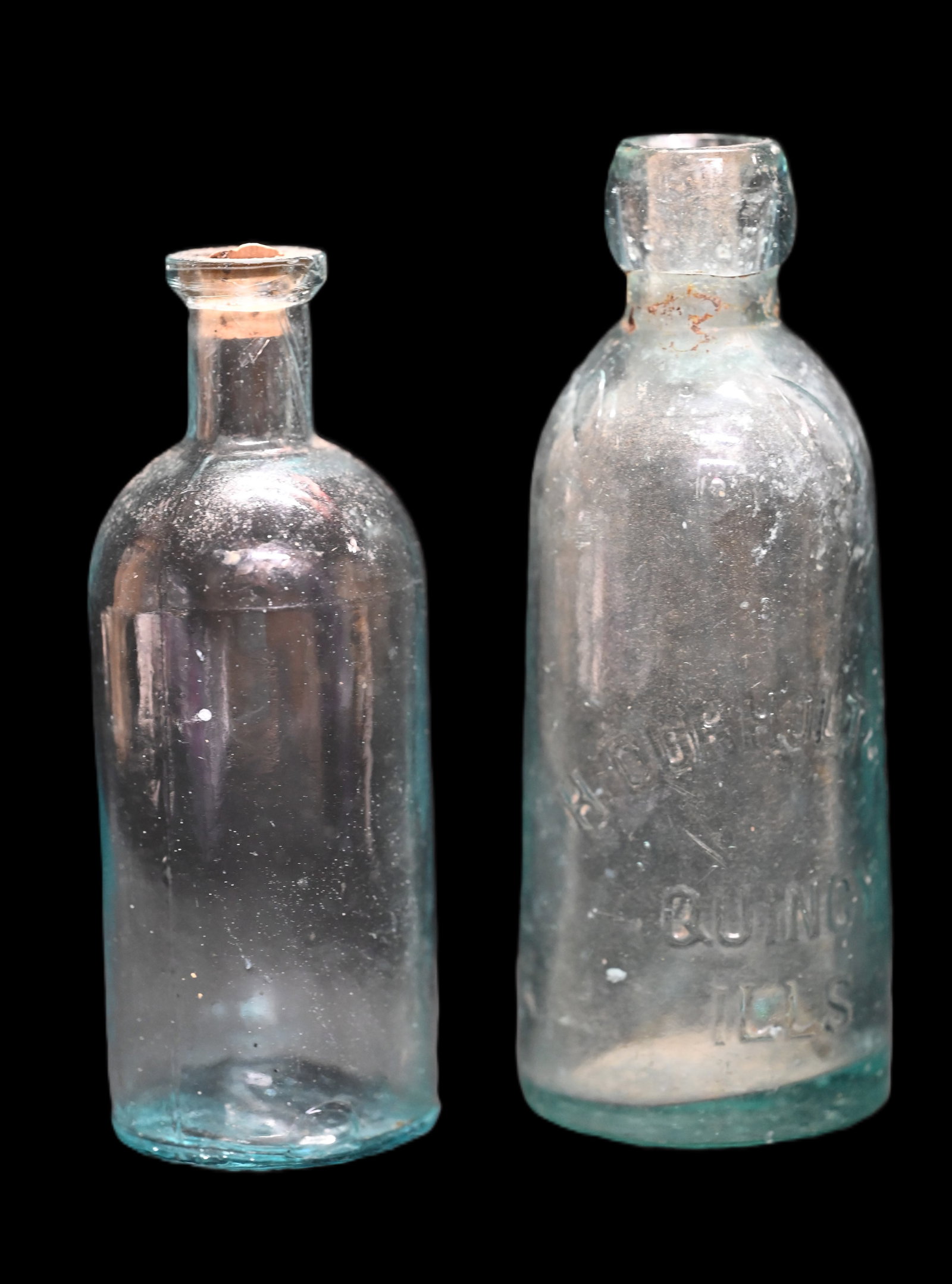 2 Vintage Glass Bottles, H Durholt & Co. Quincy ILLS and an unmarked bottle. Tallest measures 6: 2 Vintage Glass Bottles, H Durholt & Co. Quincy ILLS and an unmarked bottle. Tallest measures 6 5/8" Tall.